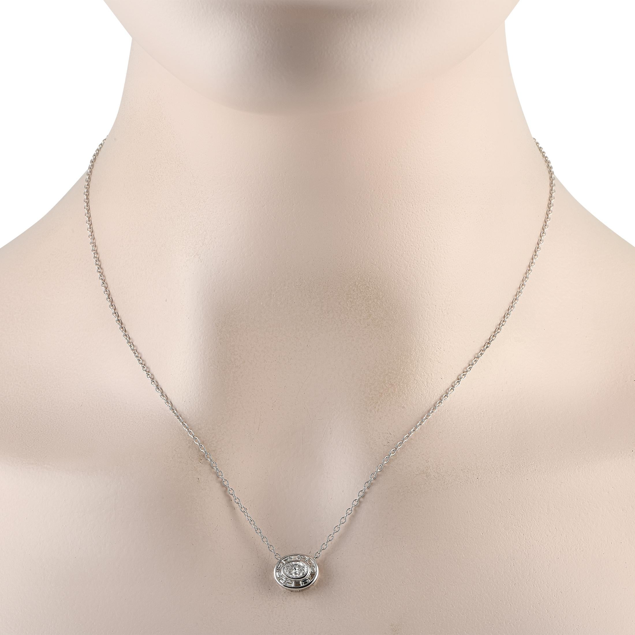 This is the necklace that will add a touch of refinement to every outfit. This white gold piece features an oval-shaped pendant bearing a 0.51-carat oval diamond center in a bezel setting, haloed by 0.49 ct tapered baguette diamonds. The pendant