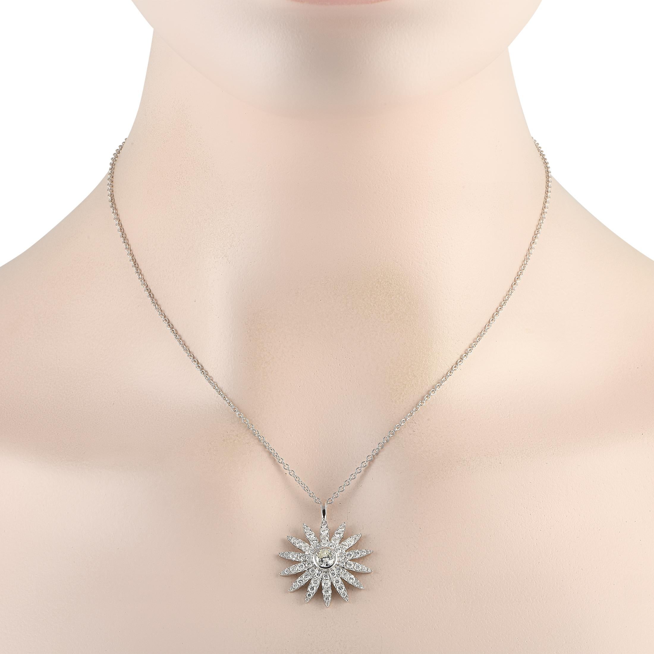 Sparkle and shine with this 18K white gold diamond necklace. An piece, it features a 17-long chain holding a 1.15 x 1.00 sunflower-inspired pendant. A 0.42 ct round-cut diamond mounted on a bezel sits at the center of the pendant. Golden rays traced