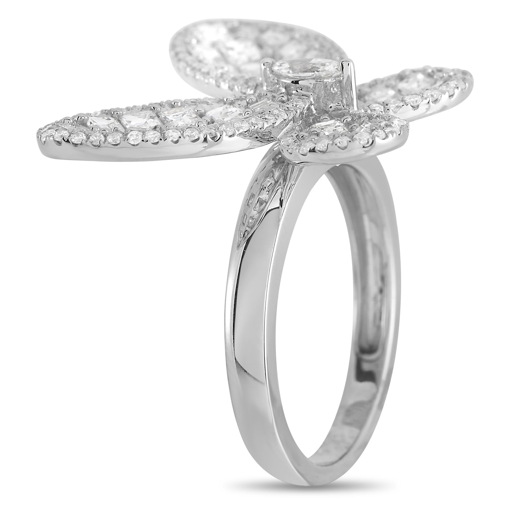 This 18K white gold ring is endless charming. A breathtaking butterfly comes to life thanks to an array of diamonds totaling 1.93 carats, including a 0.10 carat marquise cut center diamond surrounded by 1.47 carats of asscher cut diamonds that are