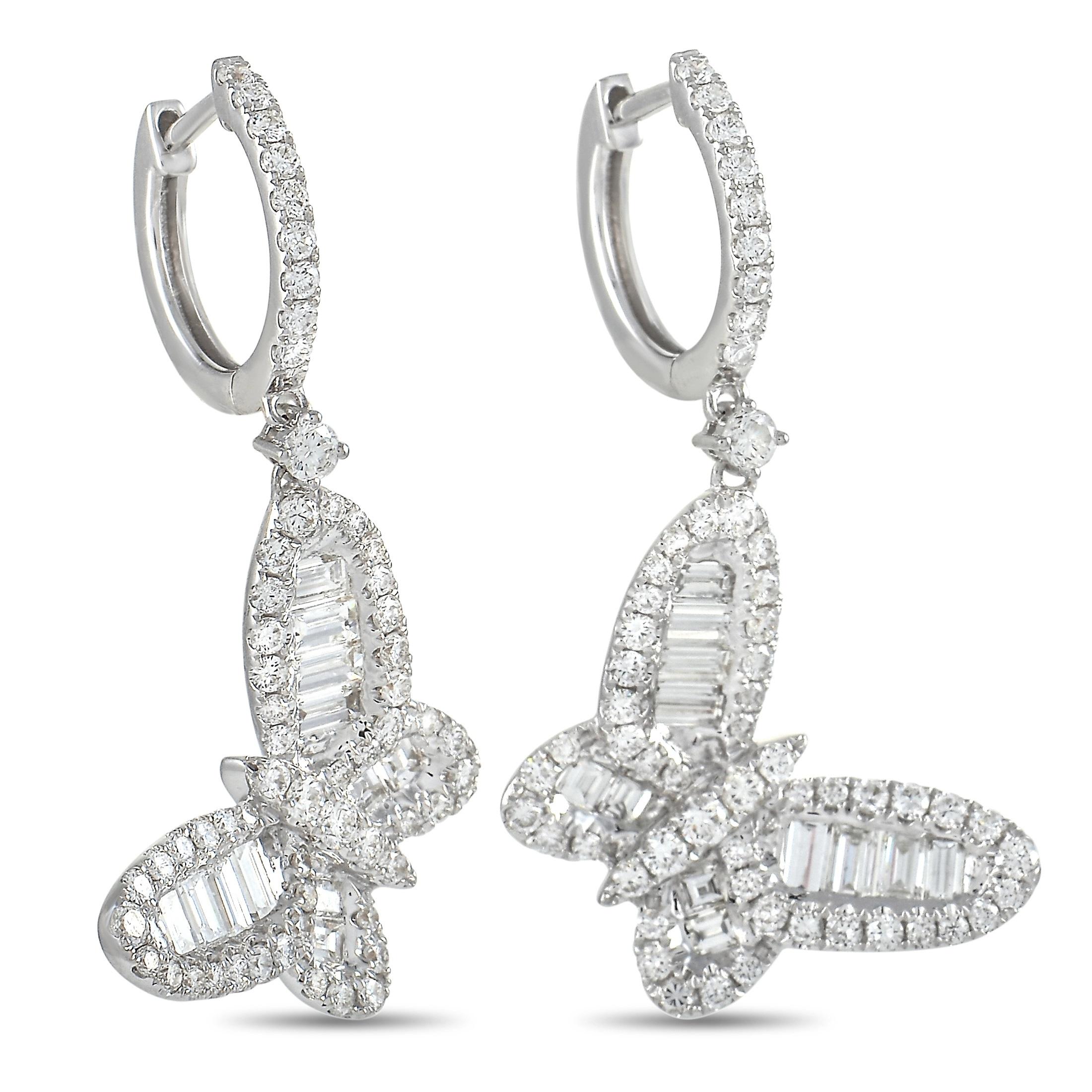 These pretty LB Exclusive butterfly earrings are made with 18K white gold, forming the hoop and a dangling butterfly charm. The charms are set with 1.25 carats of round-cut diamonds forming the butterflies body and outlining the wings, with 1.47