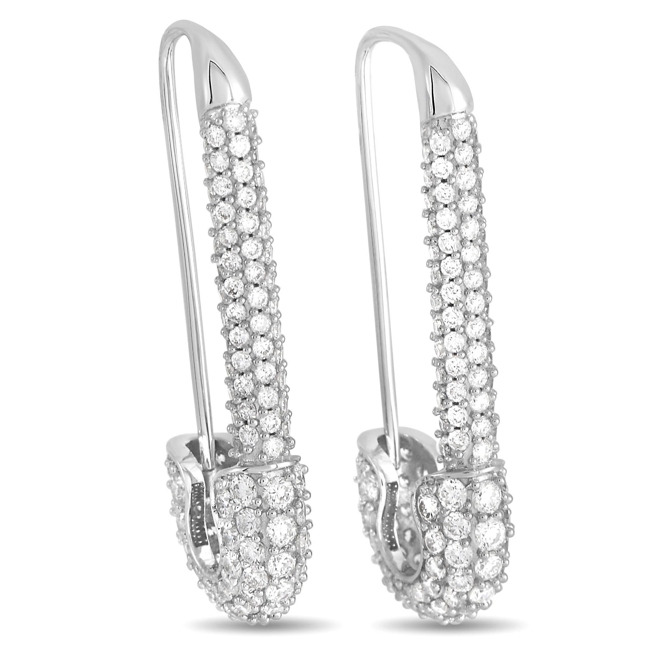 These luxury earrings will always earn a second look. Crafted from 18K White Gold to look like safety pins, their charming setting measures 1.37” long and 0.55” wide. Uniquely elegant, diamonds totaling 3.25 carats make them even more exceptional. 

