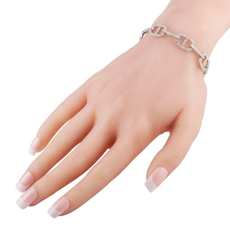This versatile 18K White Gold bracelet will add a touch of luxury to any ensemble it’s paired with. Diamonds with a total weight of 4.30 carats allow it to seemingly radiate light. This piece measures 7.0” long
 This jewelry piece is offered in new