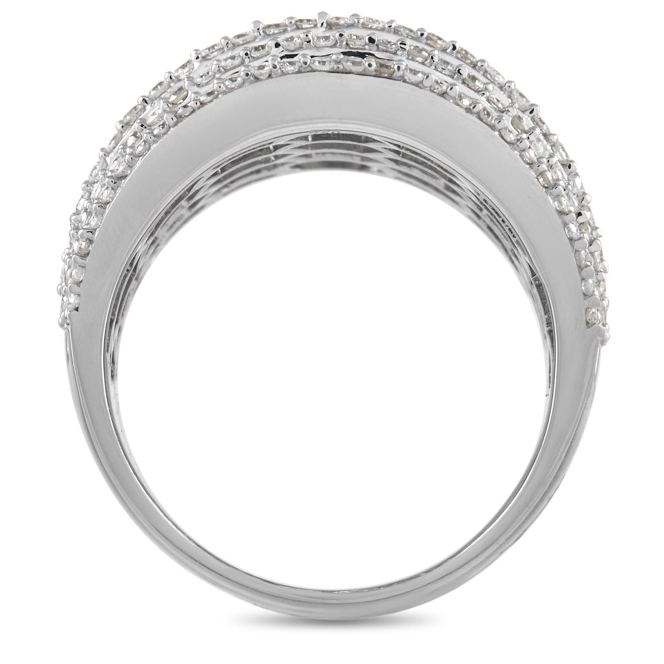 Diamond baguettes totaling 3.75 carats and round-cut diamonds with a total weight of 1.00 carats make this ring a luxurious addition to any ensemble. Bold and breathtaking in design, it features a sleek 18K white gold setting with a 12mm wide band