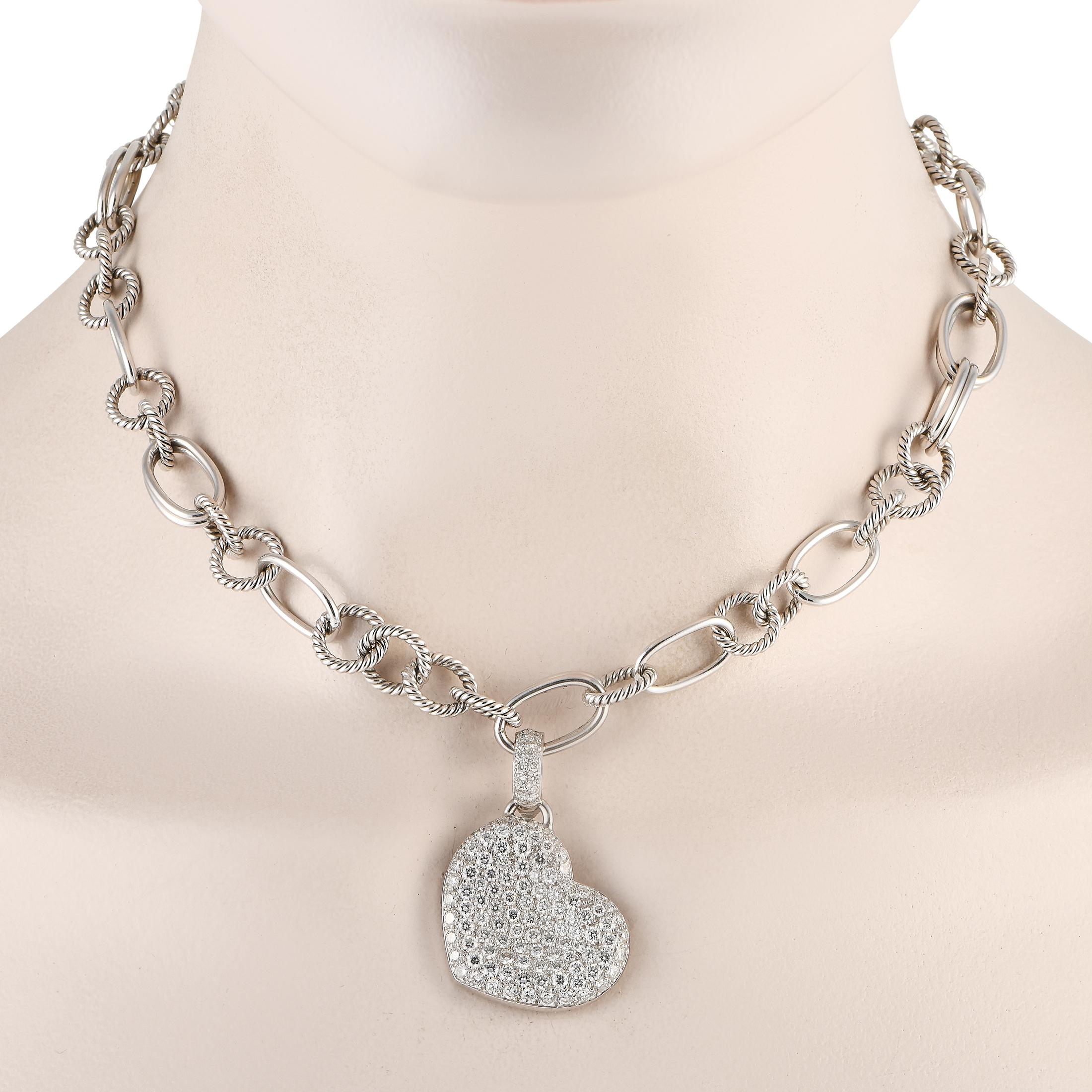 A dynamic chain measuring 17” long makes this 18K White Gold necklace uniquely elegant. Suspended at the center, a heart-shaped pendant measuring 1.5” long and 0.5” wide sparkles to life thanks to diamonds with a total weight of approximately 5.0