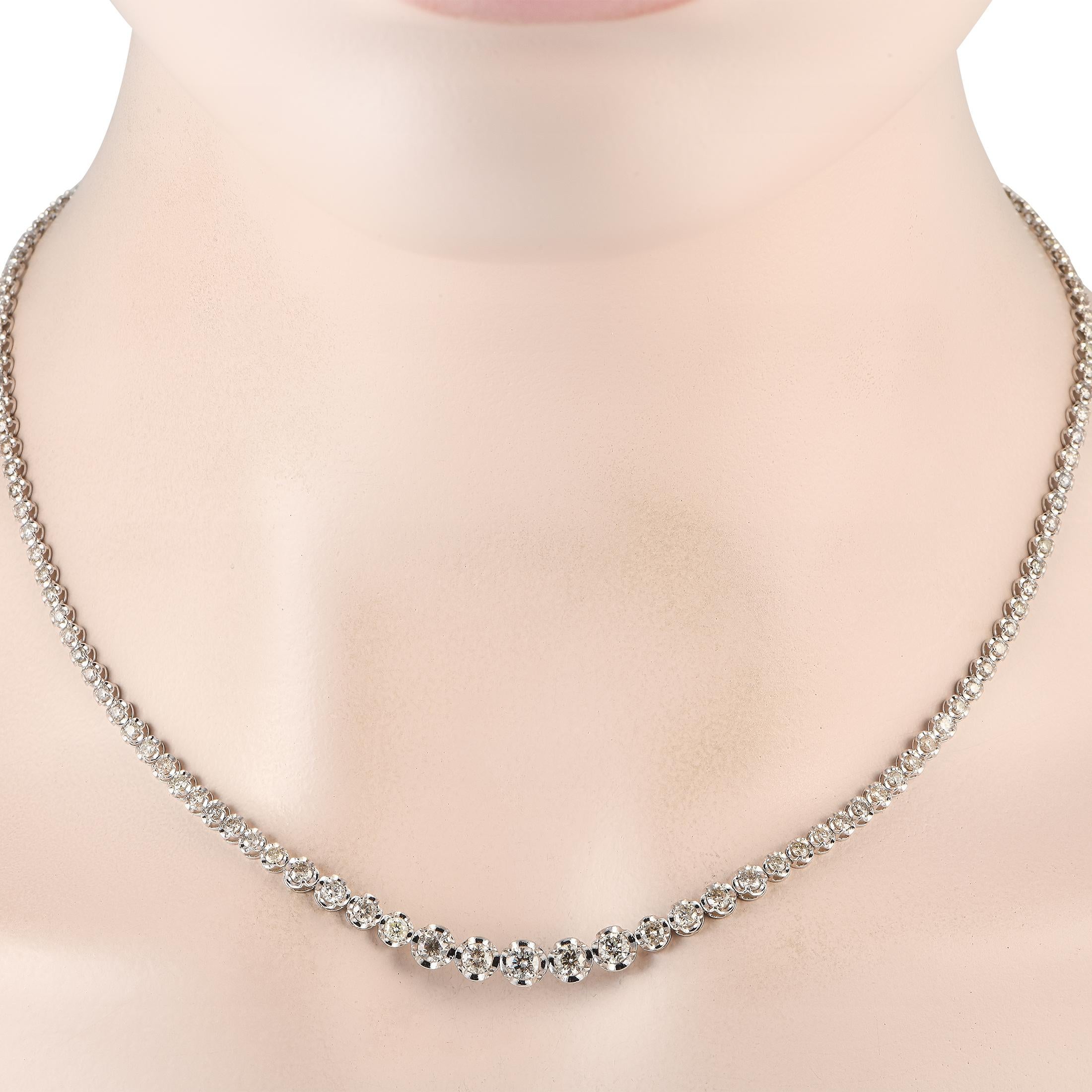 Elevate any ensemble with this simple, elegant necklace. This pieces impeccable design is elevated by sparkling diamonds totaling 5.0 carats and an 18K White Gold setting measuring 18 long.This jewelry piece is offered in brand new condition and