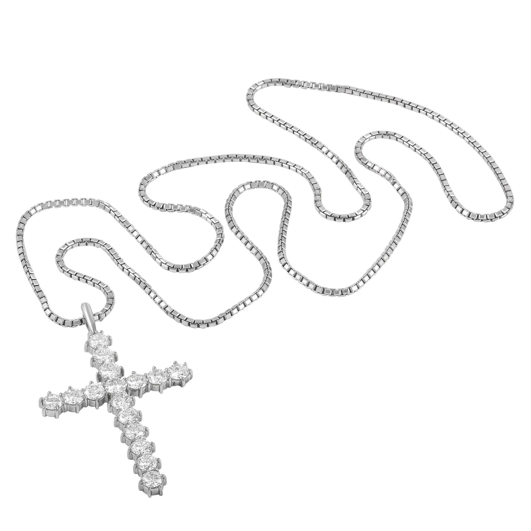 This LB Exclusive cross necklace is a classic piece. The necklace is made with an 18K white gold chain, highlighting the matching 18K white gold cross pendant. The pendant is set with 7.00 carats of round-cut diamonds of H-color and SI-1 clarity