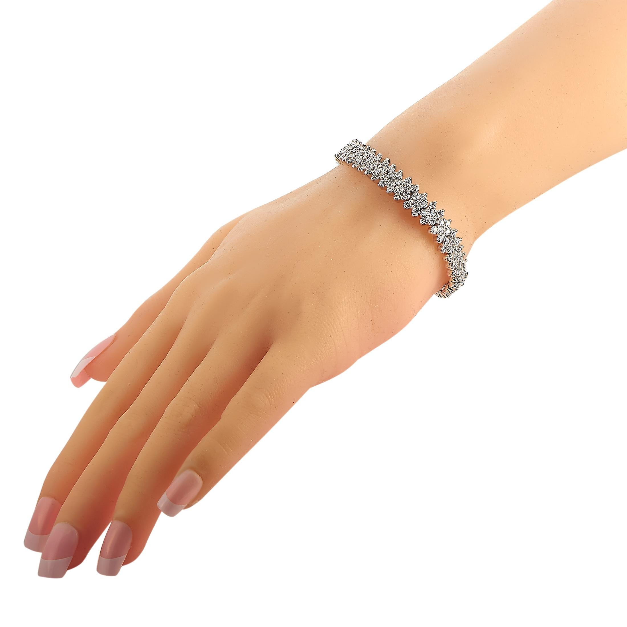 This LB Exclusive bracelet is made of 18K white gold and embellished with diamonds that amount to 8.11 carats. The bracelet weighs 26.1 grams and measures 7” in length.
 
 Offered in estate condition, this jewelry piece includes a gift box.