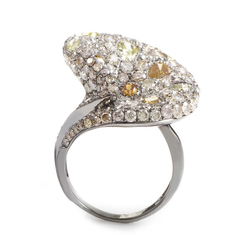 A lavish pave of different diamonds makes this uniquely designed ring a true standout! The ring is made of rhodium-treated 18K white gold and is set with a pave of ~7.86ct of diamonds.