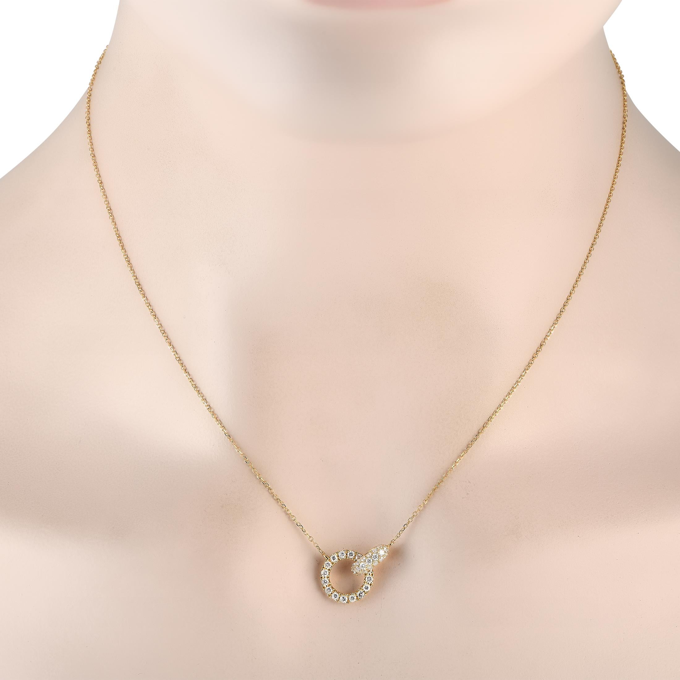 Clean lines, small size, and restrained sparkle characterize the minimalist beauty of this piece. The 16 necklace chain with a lobster clasp holds a 0.5 by 0.65 pendant composed of two circles linked together. The flat circle comes neatly outlined