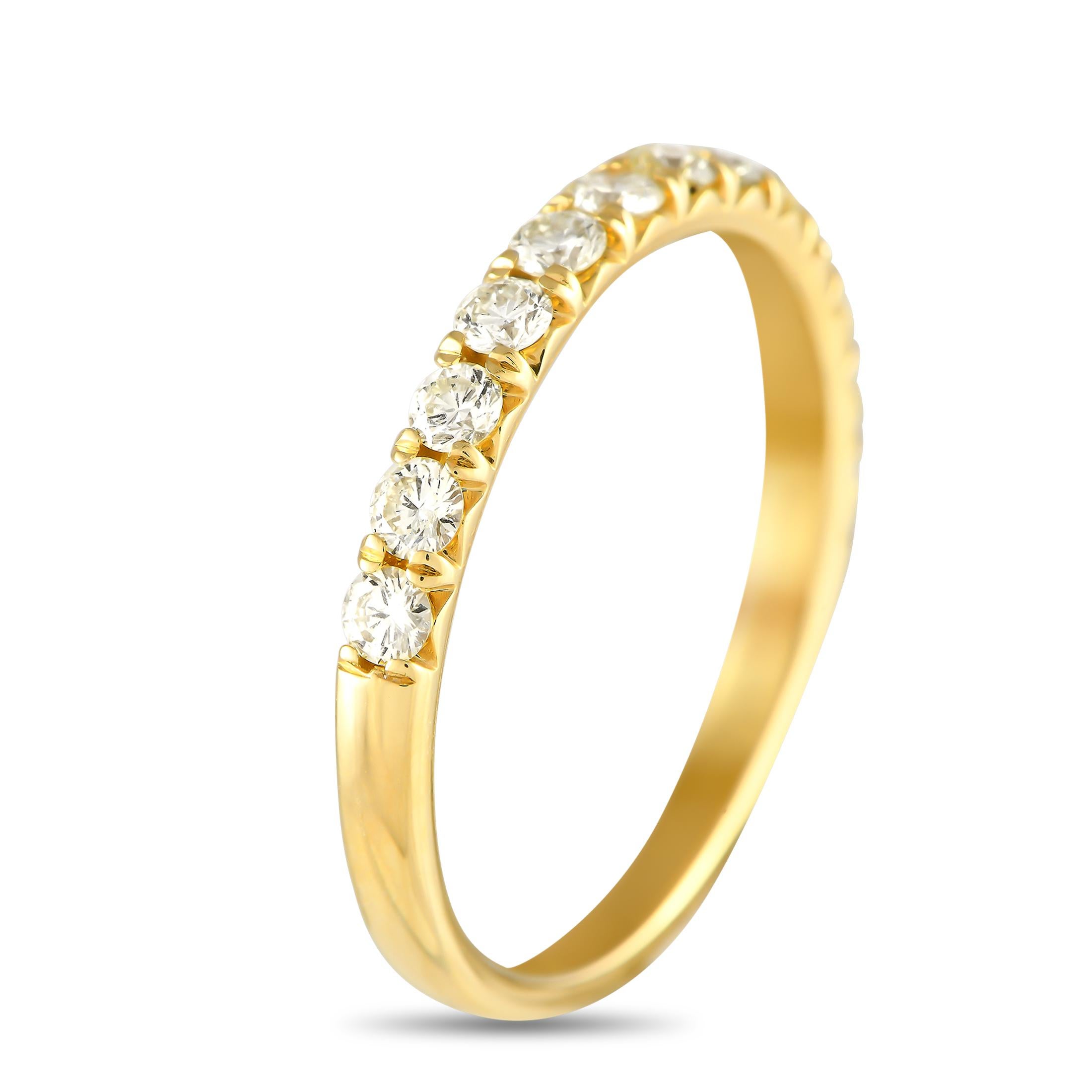Simple, elegant, and understated, this luxury ring is ideal for everyday wear. The top of the 18K yellow gold setting  which features a 2mm wide band and a 1mm top height  comes to life thanks to a series of diamonds totaling 0.55 carats.This