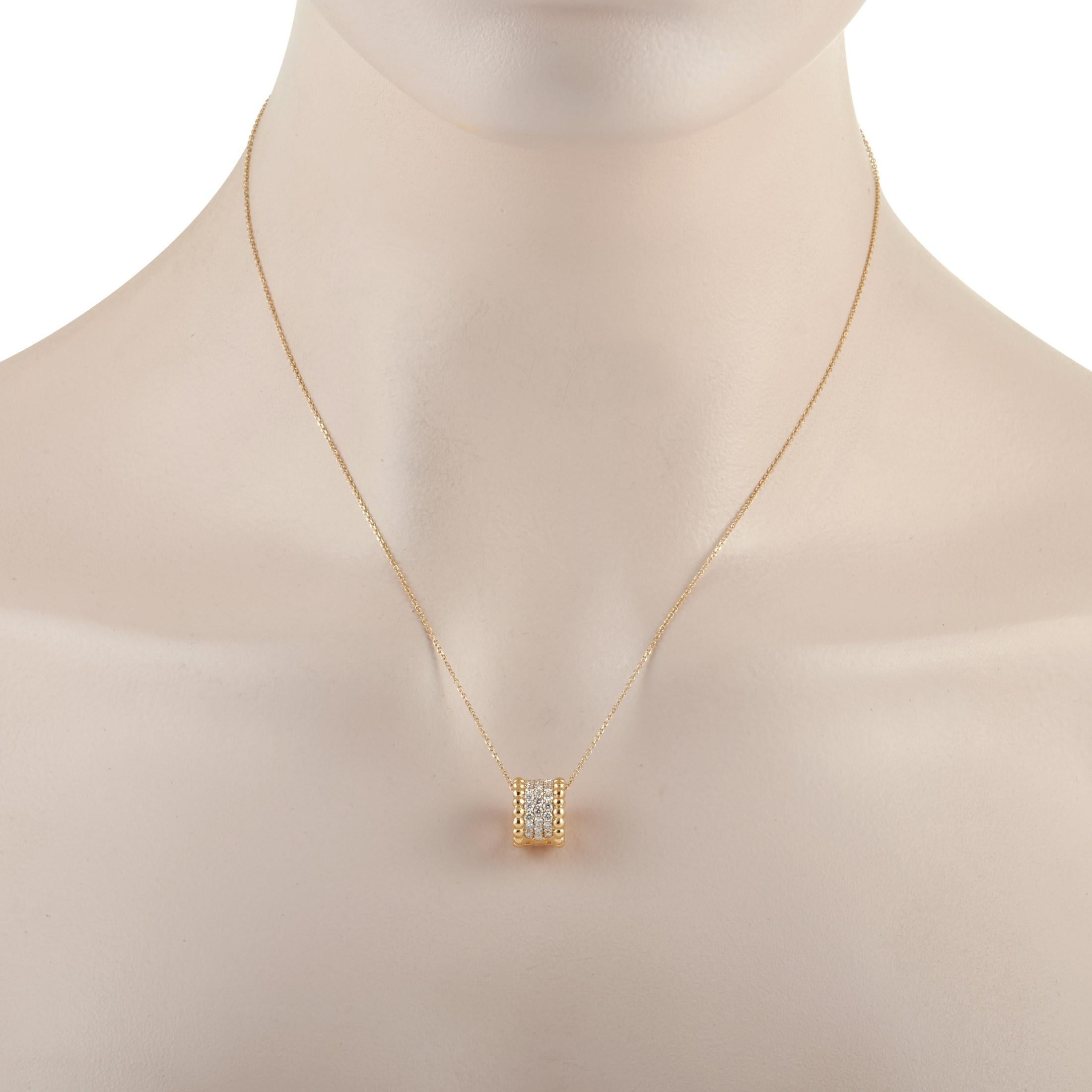 This modern LB Exclusive pendant necklace is made with an 18K yellow gold chain and features a yellow gold pendant set with three rows of round diamond measuring 0.58 carats. The dainty 18K yellow gold chain measures 17 inches in length. The diamond