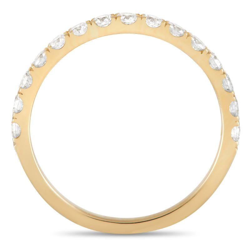 Simple, elegant, and understated, this luxury ring is ideal for everyday wear. The top of the 18K Yellow Gold setting – which features a 2mm wide band and a 1mm top height – comes to life thanks to a series of diamonds totaling 0.61 carats. 
 
 This