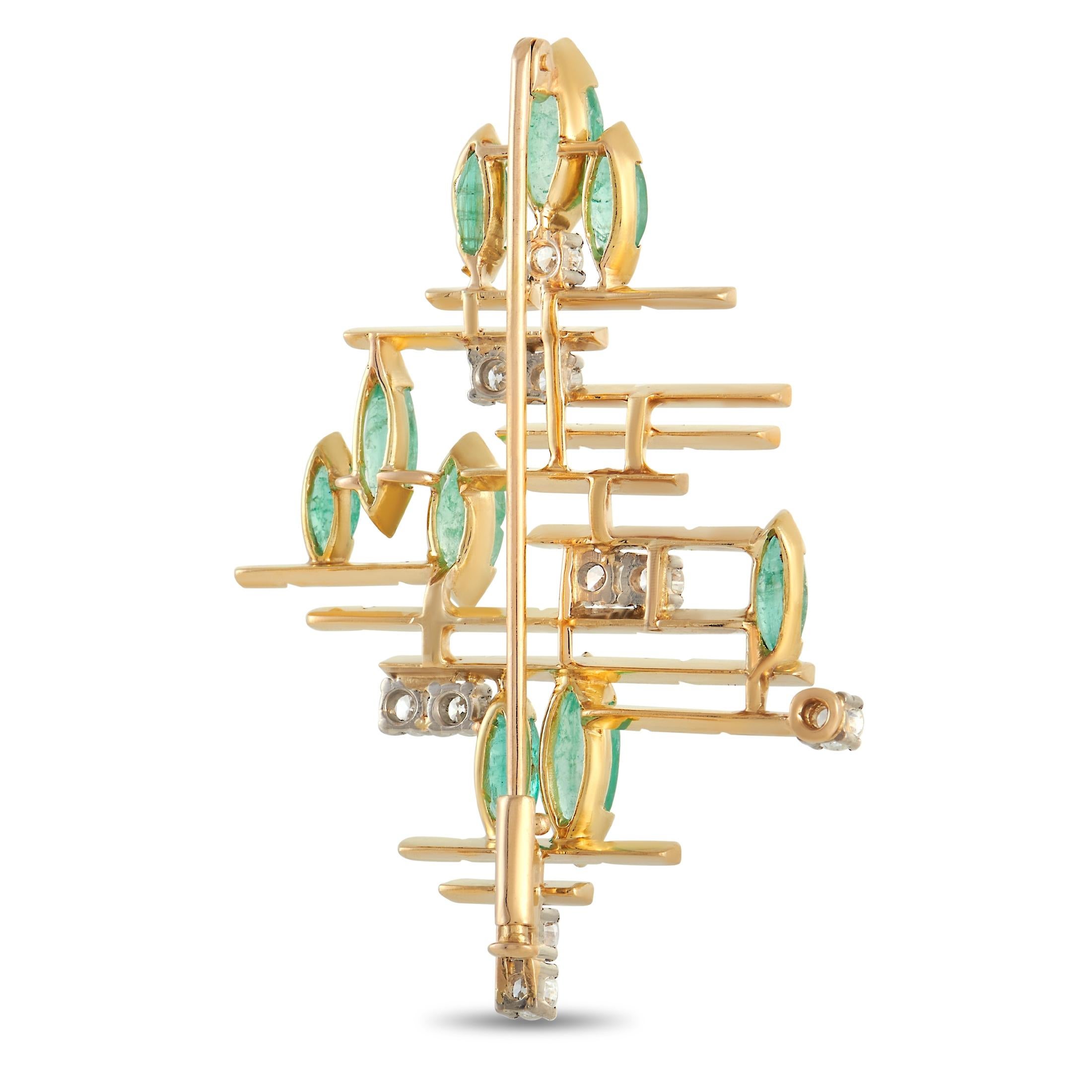 This classy brooch is a unique piece. The asymmetrical setting is made from 18K yellow gold and set with a handful of round diamonds totaling 0.70 carats, and approximately 4.50 carats of emeralds. The brooch measures 2.19 inches in length and 1.5