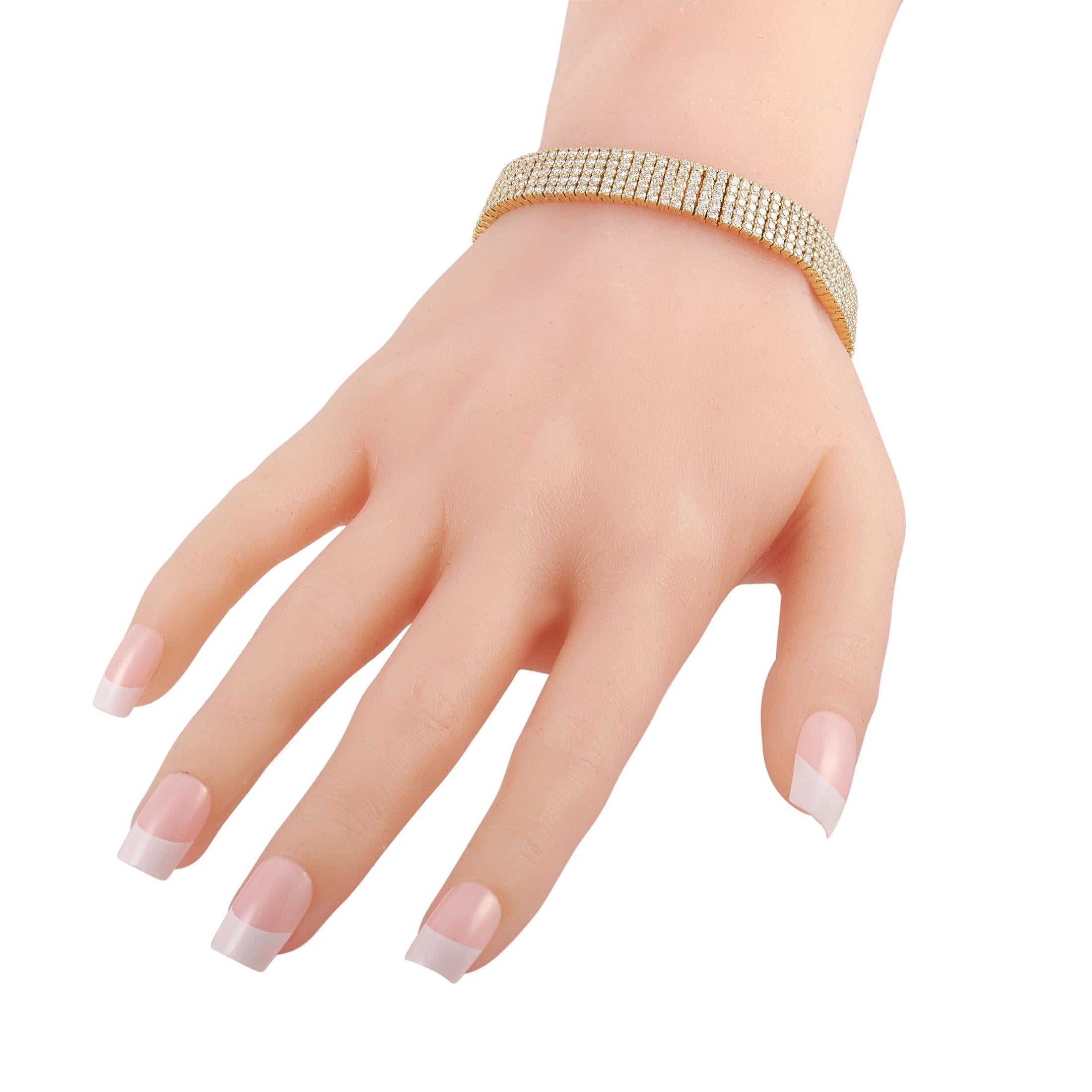 The LB Exclusive 18K Yellow Gold 10.59 carat Five Row Diamond Mesh Bracelet is a classy piece of jewelry that never goes out of style. This piece is designed with five rows of diamonds wrapping all the way around the wrist. The glittering wide