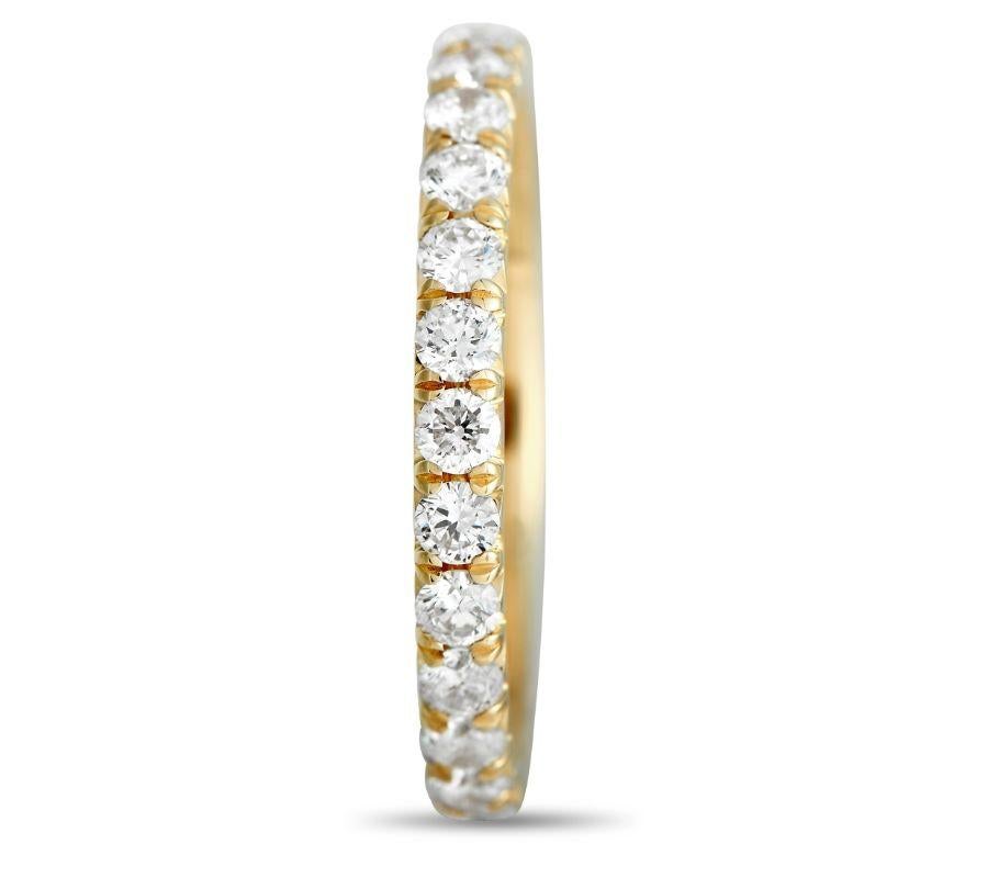 Sparkling diamonds totaling 1.30 carats allow this band ring to effortlessly catch the light. This piece’s stunning 18K yellow gold setting measures 2mm wide. 
 
 This jewelry piece is offered in brand new condition and includes a gift box.