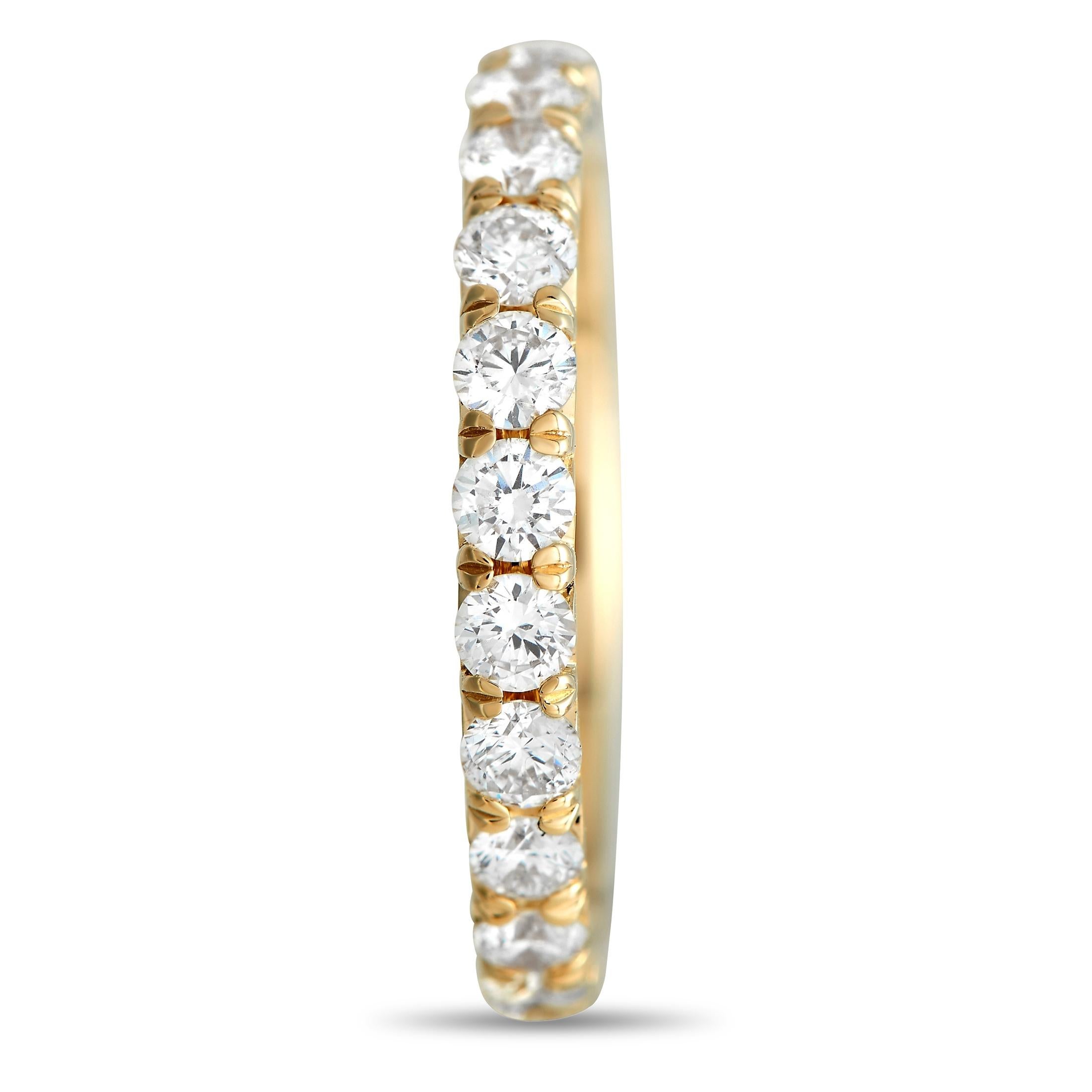 Sparkling diamonds totaling 1.75 carats allow this band ring to effortlessly catch the light. This piece’s stunning 18K yellow gold setting measures 2mm wide. 
 
 This jewelry piece is offered in brand new condition and includes a gift box.