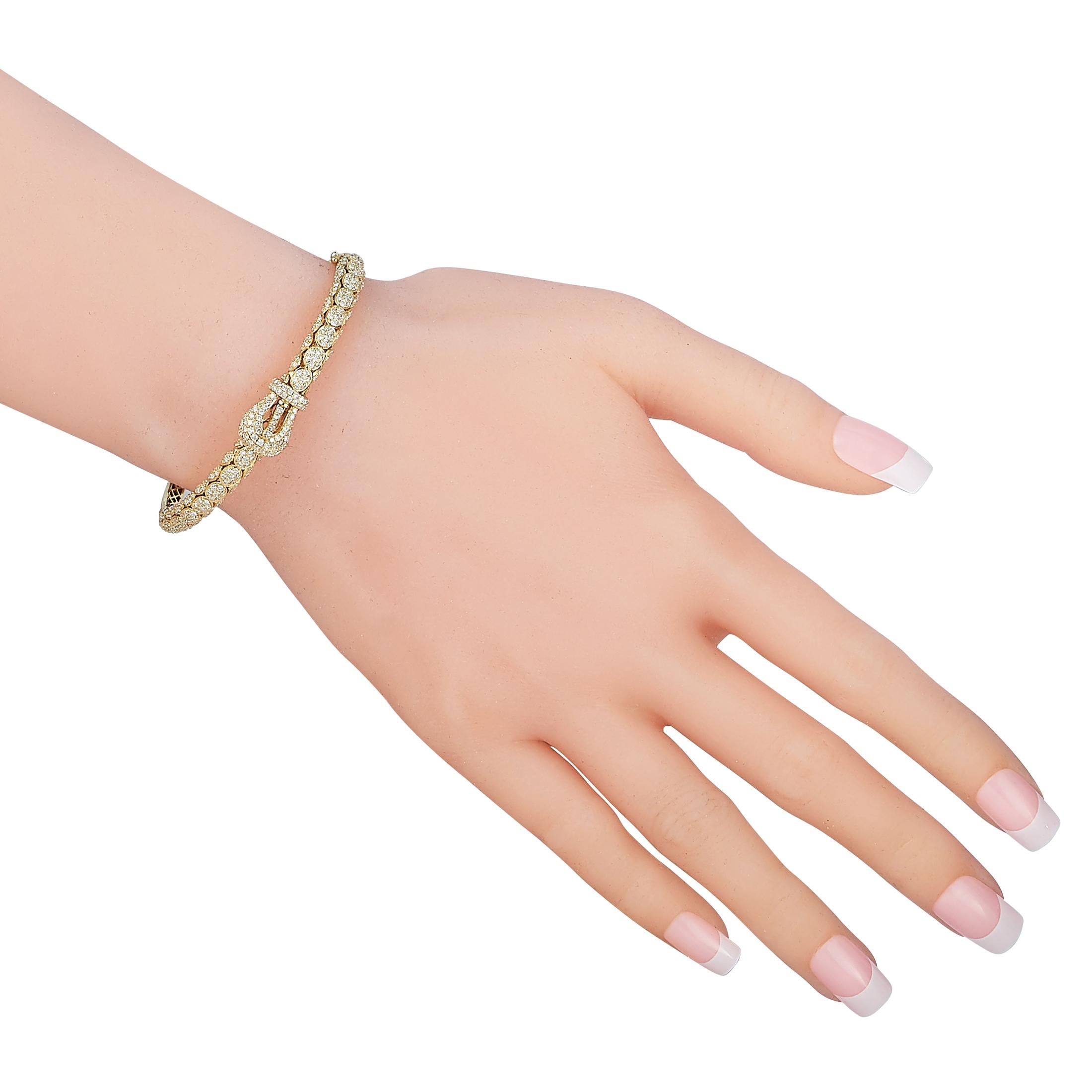 This LB Exclusive bracelet is crafted from 18K yellow gold and weighs 17.5 grams, measuring 7” in length. The bracelet is embellished with diamonds that amount to 2.20 carats.

Offered in brand new condition, this jewelry piece includes a gift box.