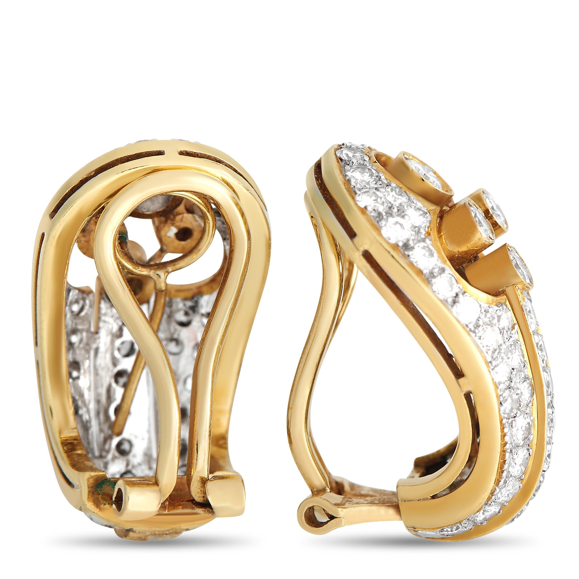 There’s something incredibly refined about these exquisitely crafted earrings. Each one features a bold 18K Yellow Gold setting measuring 1.0” long and 0.5” wide. The lustrous setting contrasts beautifully against the inset diamonds, which together