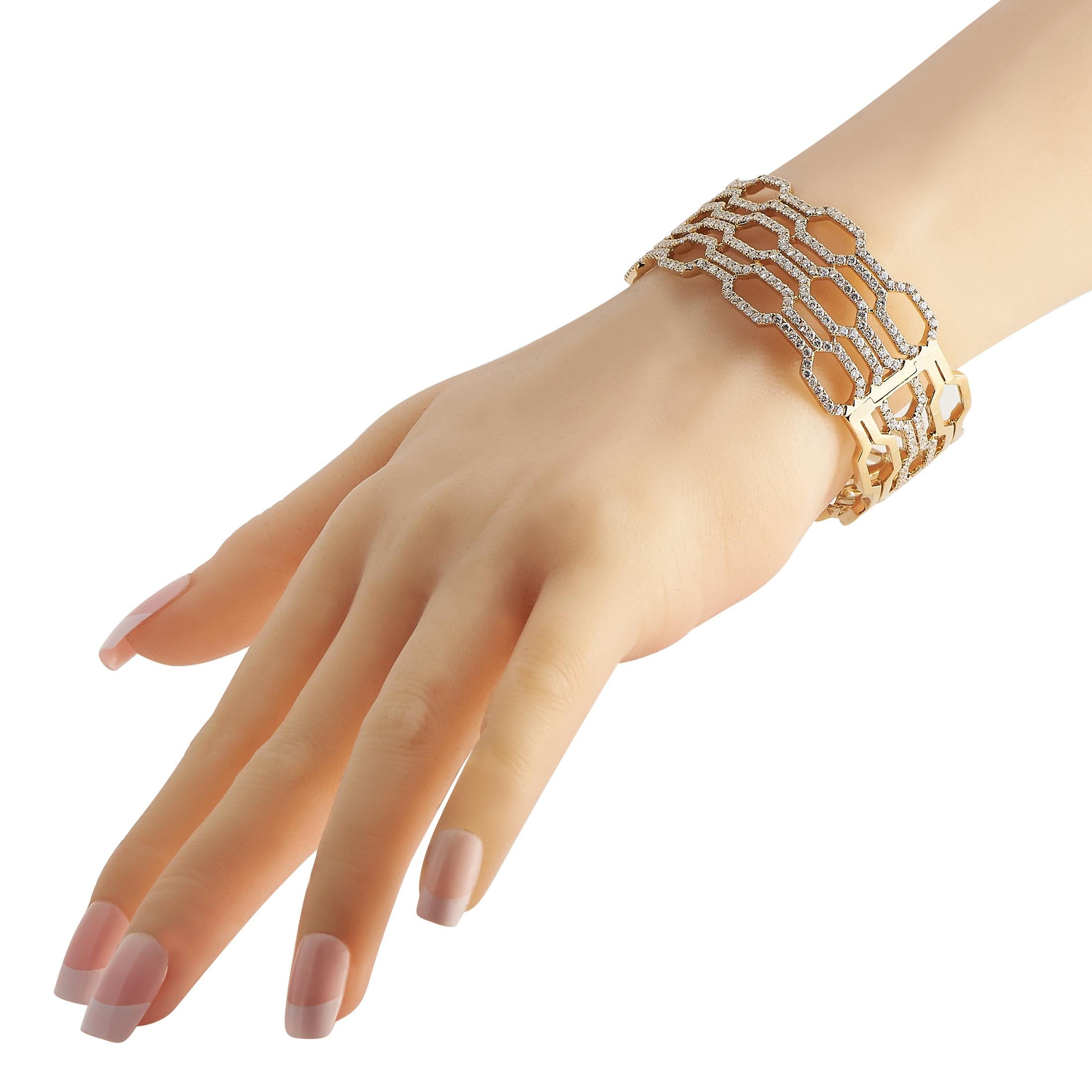 Shape up your style with the edgy elegance of this geometric jewelry. This LB Exclusive bracelet comes in 18K yellow gold and features a wide, openwork bangle bracelet design with hexagonal links traced with round, brilliant diamonds. Whether worn