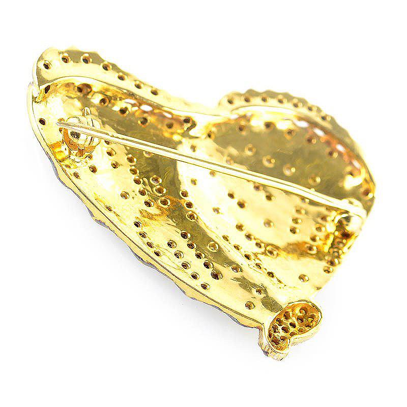 This pin is ravishing and unique. This butterfly shaped pin is made of 18K yellow and rose gold and is set with ~.65ct of white, yellow and cognac diamonds.