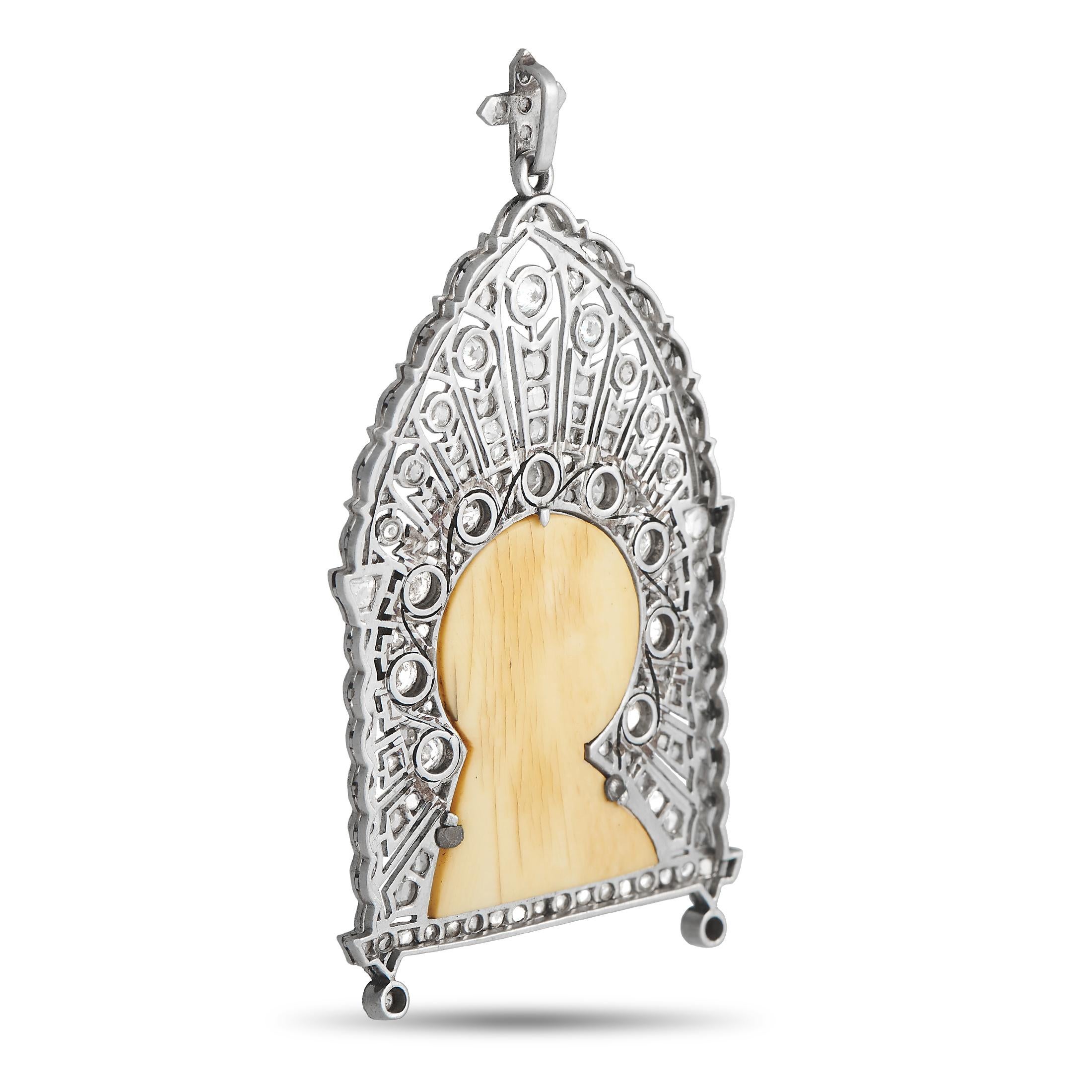 A special antique jewel to add to your or your loved one's collection. This platinum pendant features a St. Mary cameo carved from a white hard stone. It is set within an intricately crafted platinum frame with milgrain detailing and a combination