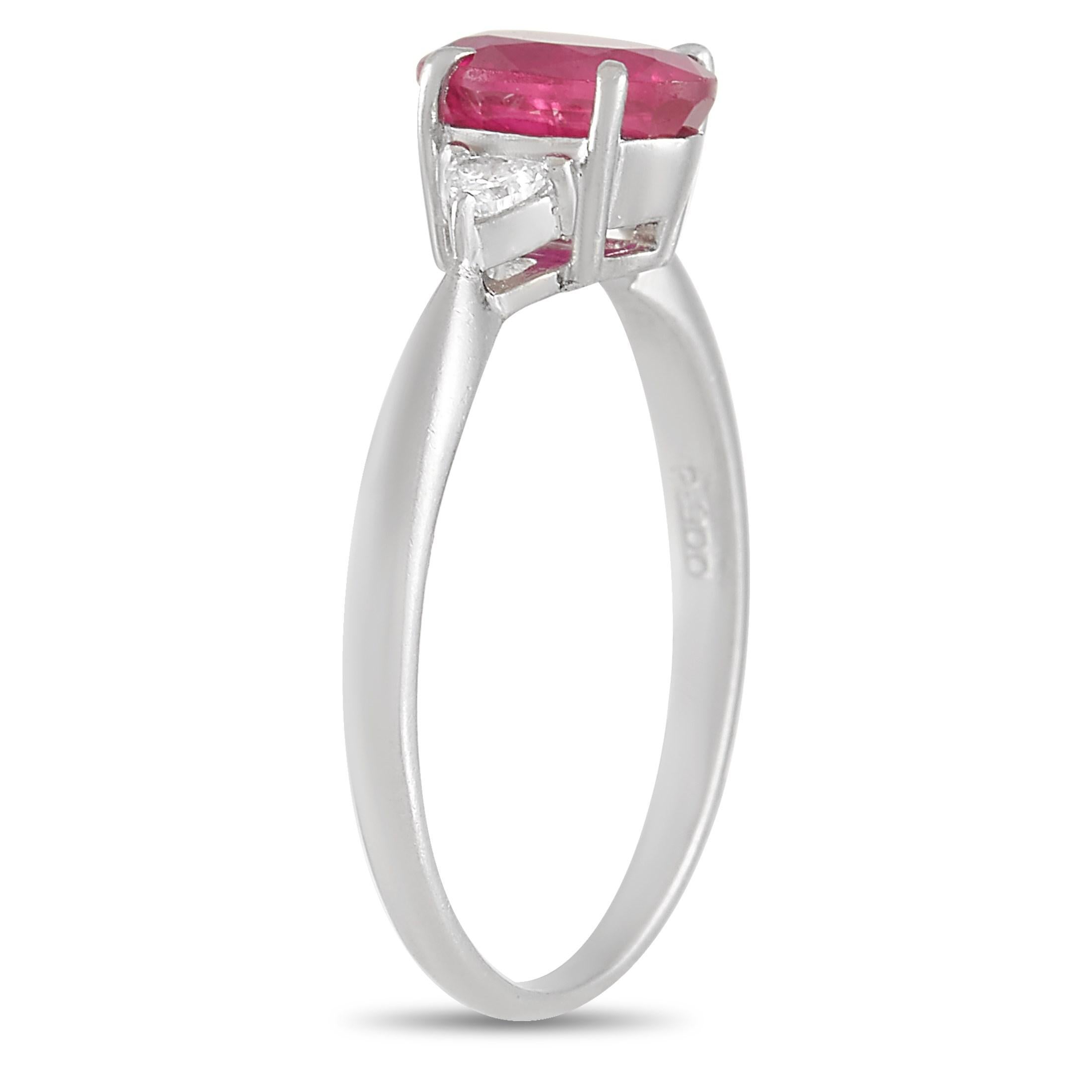 This pretty LB Exclusive Platinum 0.09 ct Diamond 1.20 ct Ruby Ring is pure class. The band is made with platinum and set with an oval cut 1.20 carat ruby held in place by four prongs and flanked on either side by a round cut diamond totaling 0.09