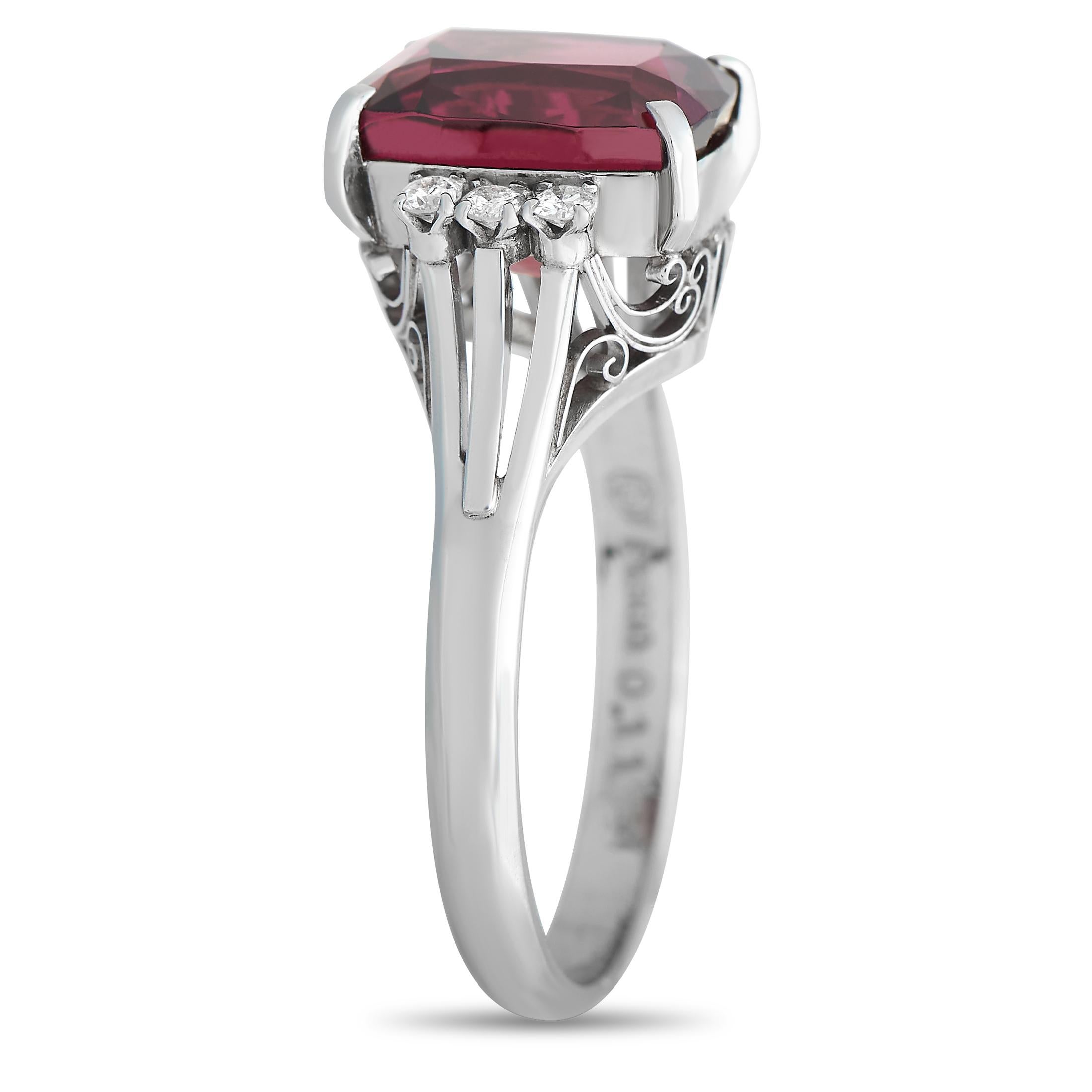 An intricate Platinum setting serves as a stunning foundation for this exquisite luxury ring. This ring’s bold 4.88 Garnet center stone adds a captivating pop of color to its classically elegant, design, while diamond accents totaling 0.11 carats