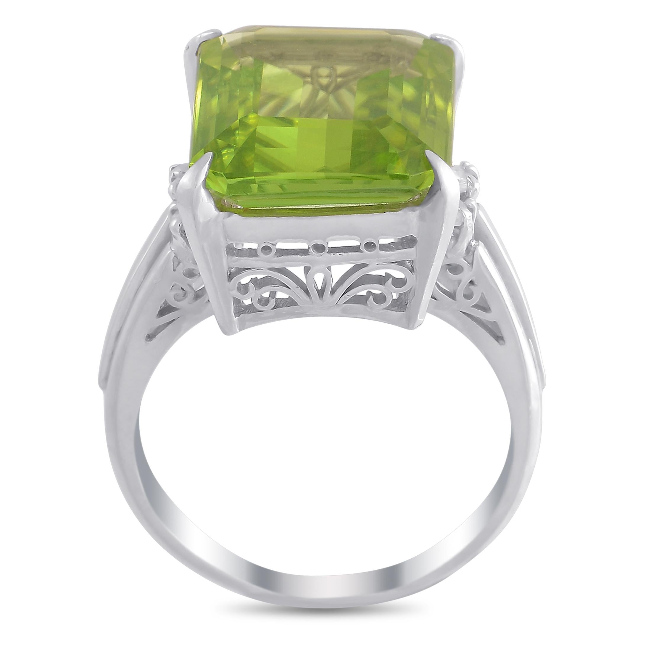 This pretty LB Exclusive Platinum 0.11 ct Diamond 8.12 ct Peridot Ring is a must have! The ring features a sturdy band made with platinum and set with a beautiful cushion-cut 8.12 carat peridot, held in place by four prongs and flanked on either