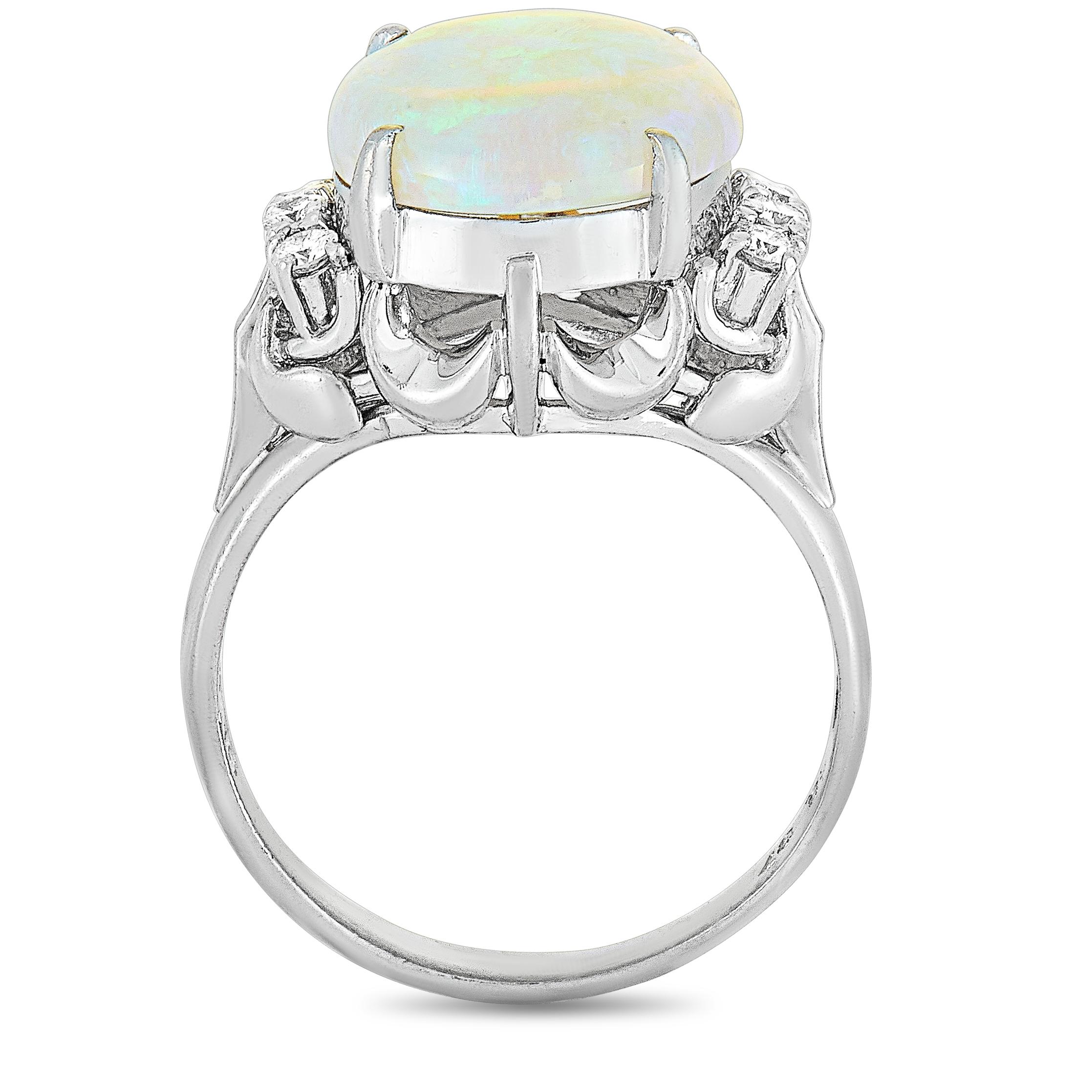 This LB Exclusive ring is made of platinum and set with a 3.37 ct opal and a total of 0.16 carats of diamonds. The ring weighs 6.5 grams, boasting band thickness of 2 mm and top height of 8 mm, while top dimensions measure 14 by 13 mm.
 
 Offered in