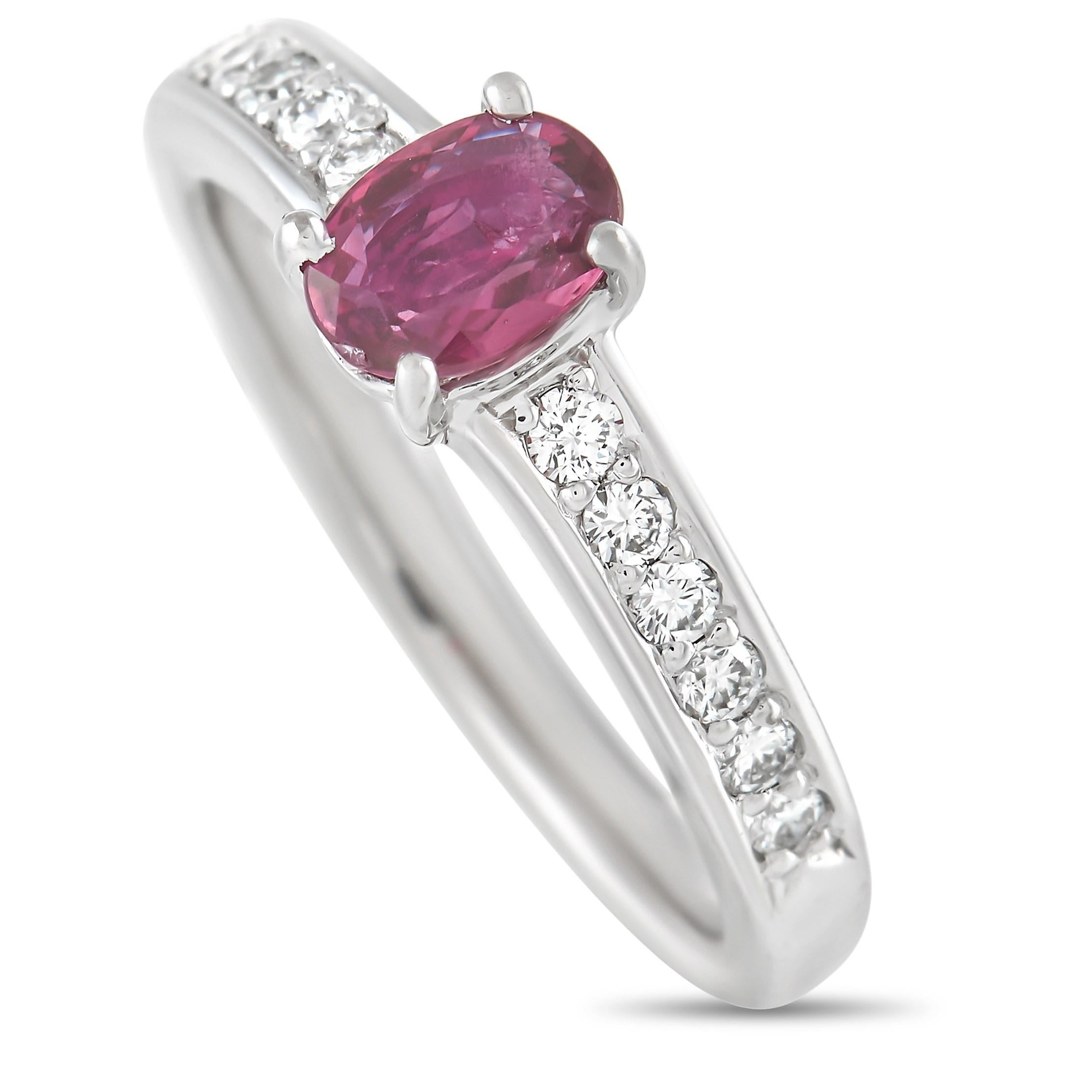 This pretty LB Exclusive ring is the perfect accessory. The band is made with platinum and set with a gorgeous 0.63 carat oval ruby center stone. The sapphire is flanked on either side by a handful of round and marquise cut diamonds totaling 0.60