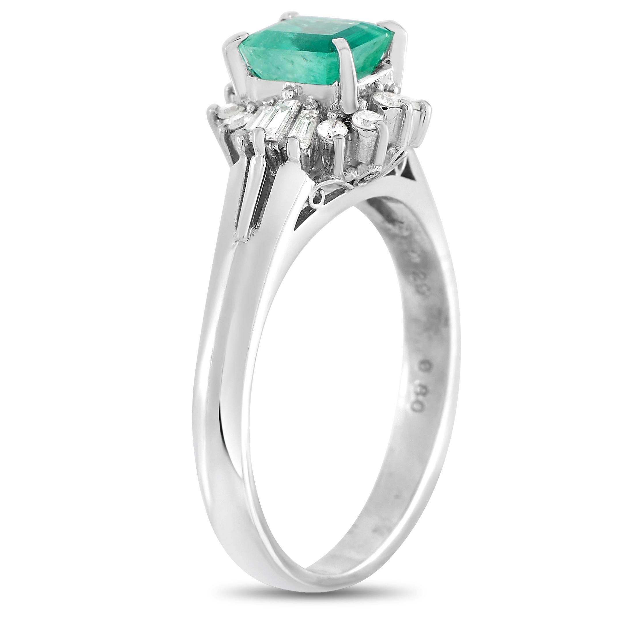 This pretty LB Exclusive Platinum 0.22 ct Diamond and Emerald Ring is made with platinum and set with a total of 0.22 carats of baguette and round diamonds surrounding the 0.80 carat emerald center stone. The ring has a band thickness of 2 mm, a top