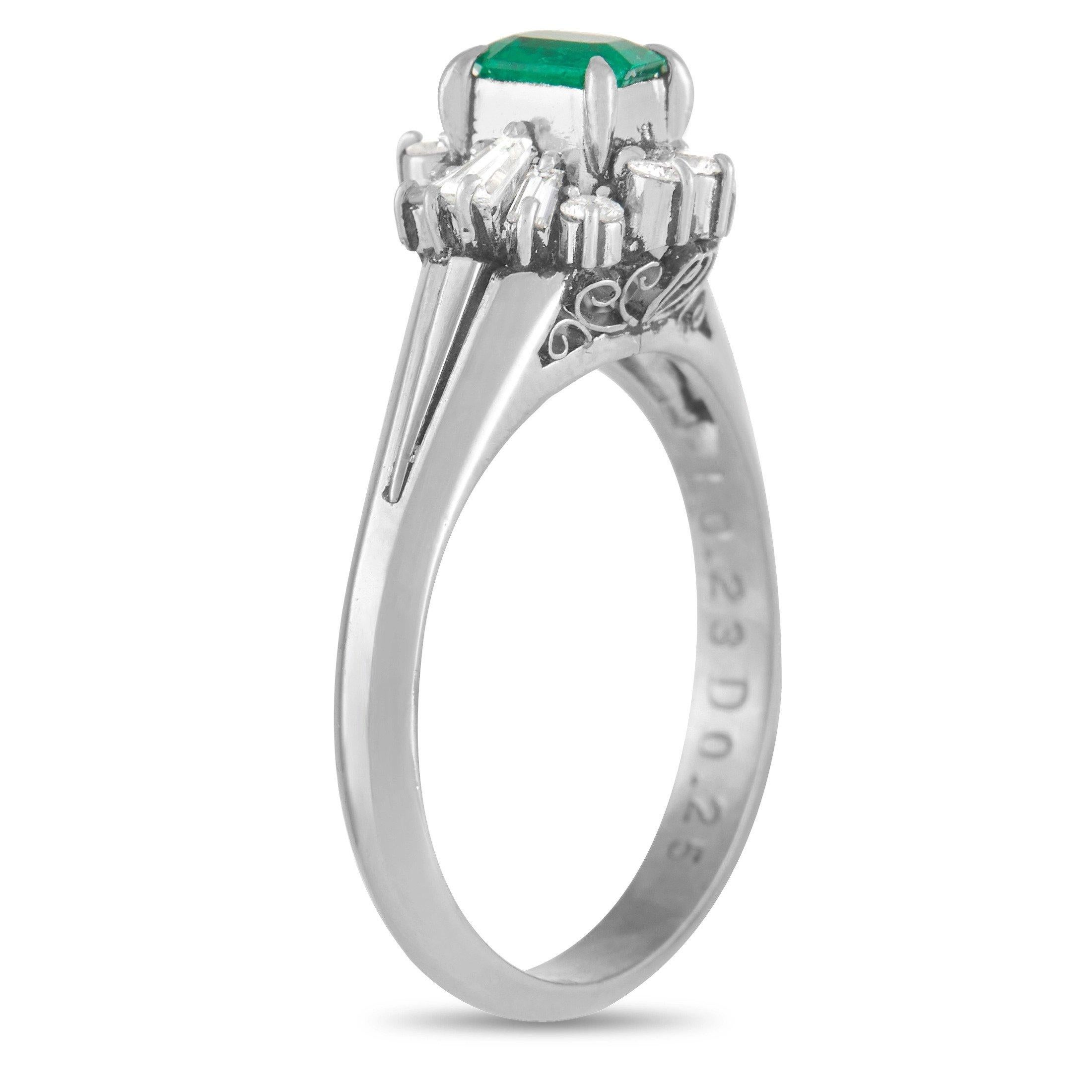 A pure platinum setting provides the perfection foundation for this timeless, elegant ring. A breathtaking green 0.23 carat emerald center stone comes to life thanks to a glittering starburst halo of diamonds with a total weight of 0.25 carats. This