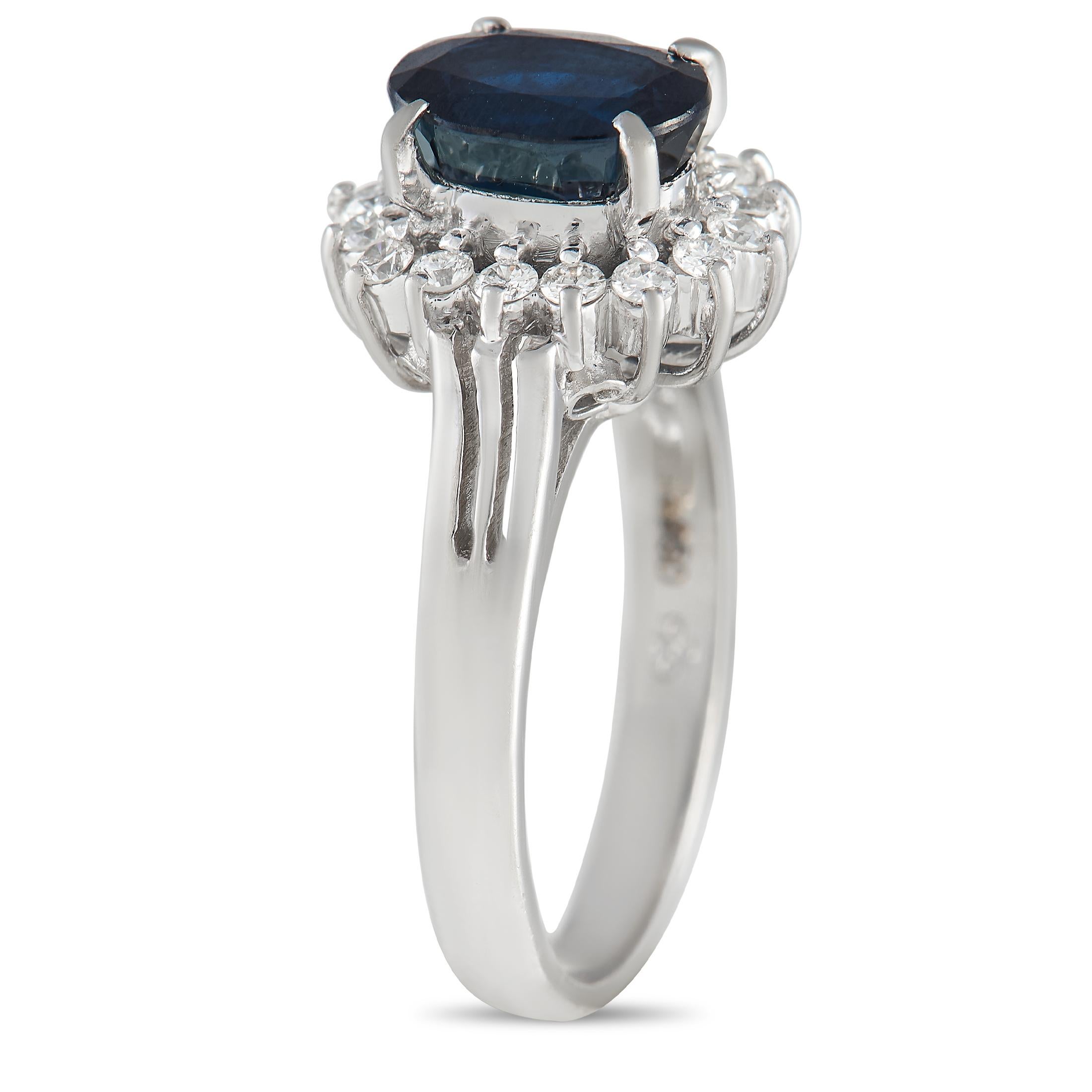 Looking for something other than a classic diamond ring? Dare to stand out with this sapphire and diamond ring. Exuding regal elegance, this platinum band comes topped with a midnight blue sapphire standing tall from an oval frame of round white