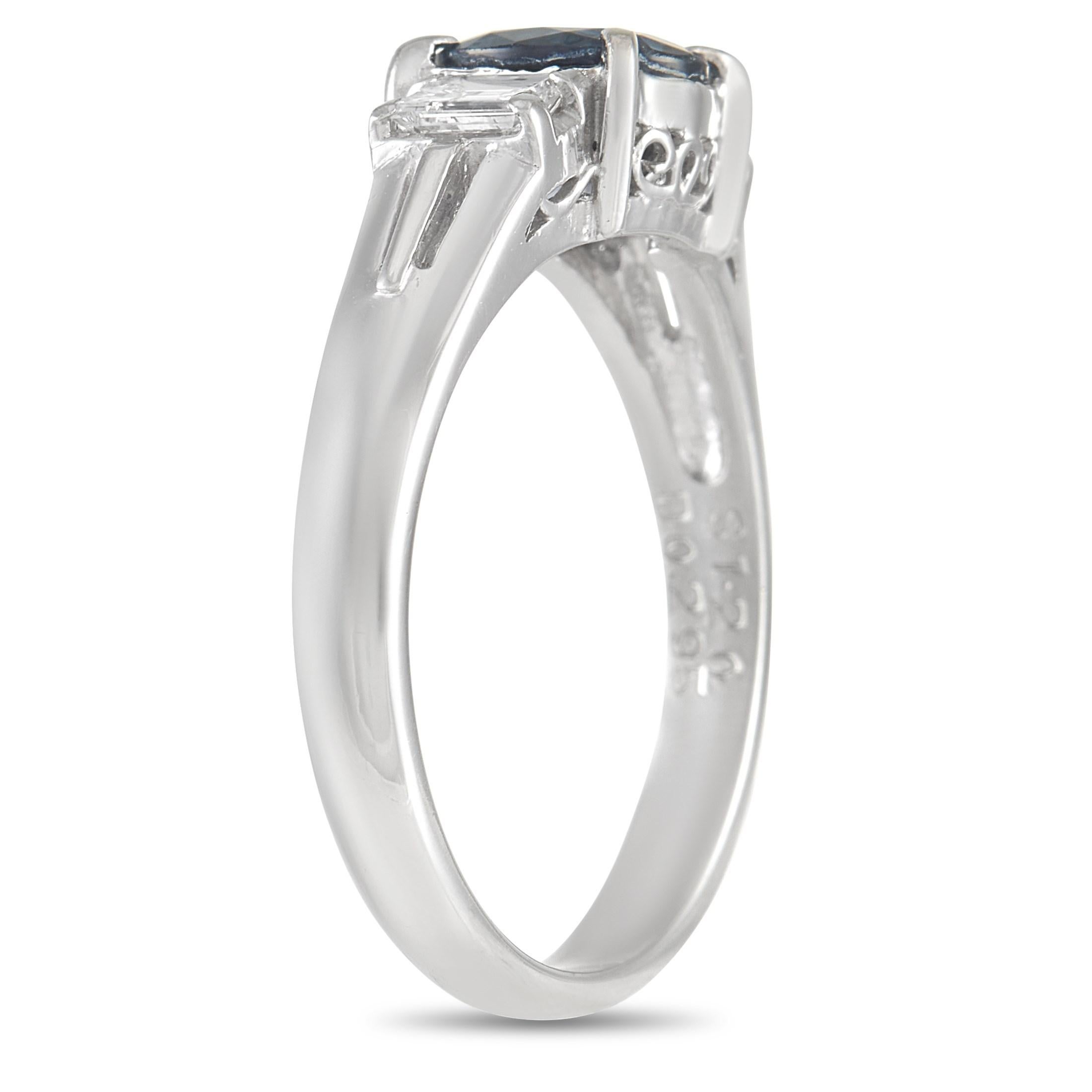 A sleek, sophisticated sense of style successfully sets this breathtaking piece apart. A platinum setting beautifully showcases the opulent deep blue 1.20 carat sapphire center stone, which is flanked by step-cut diamonds totaling 0.29 carats. A low
