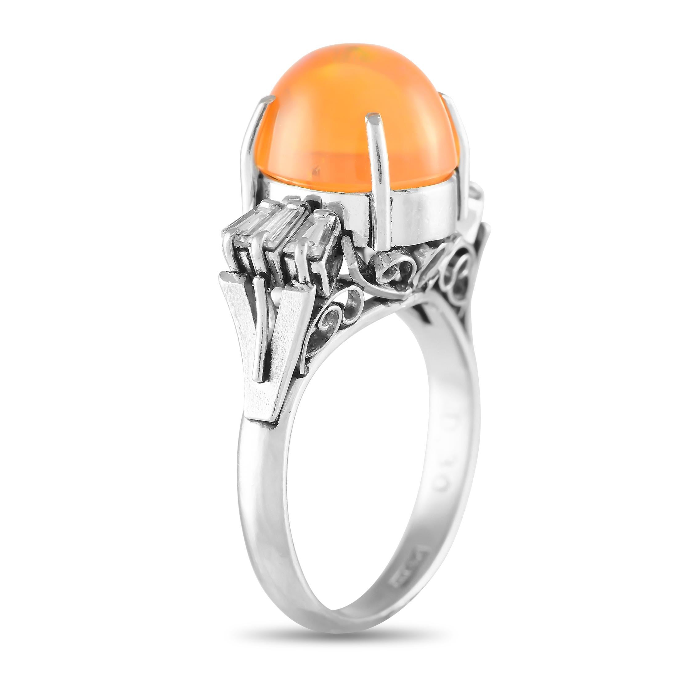 A captivating 3.40 carat fiery orange opal gemstone serves as a stunning focal point on this impressive luxury ring. Diamond baguettes with a total weight of 0.30 carats add extra luxury to the sleek platinum setting. It features a 2mm band width