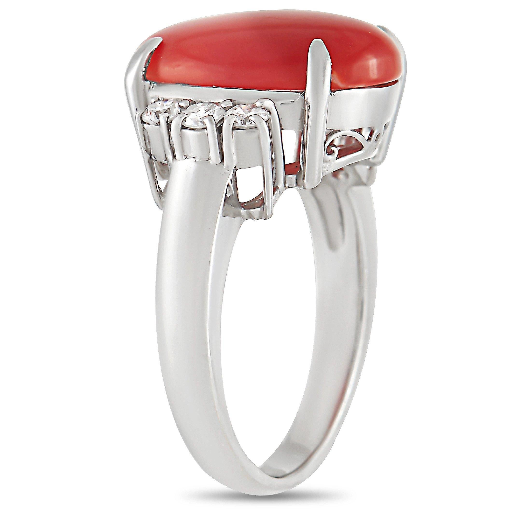 This LB Exclusive Platinum 0.31 ct Diamond 4.20 ct Coral Ring is sure to attract attention. The simple band is made with platinum and showcases the beautiful 4.20 carat oval coral center stone. The coral is flanked on either side by a row of three