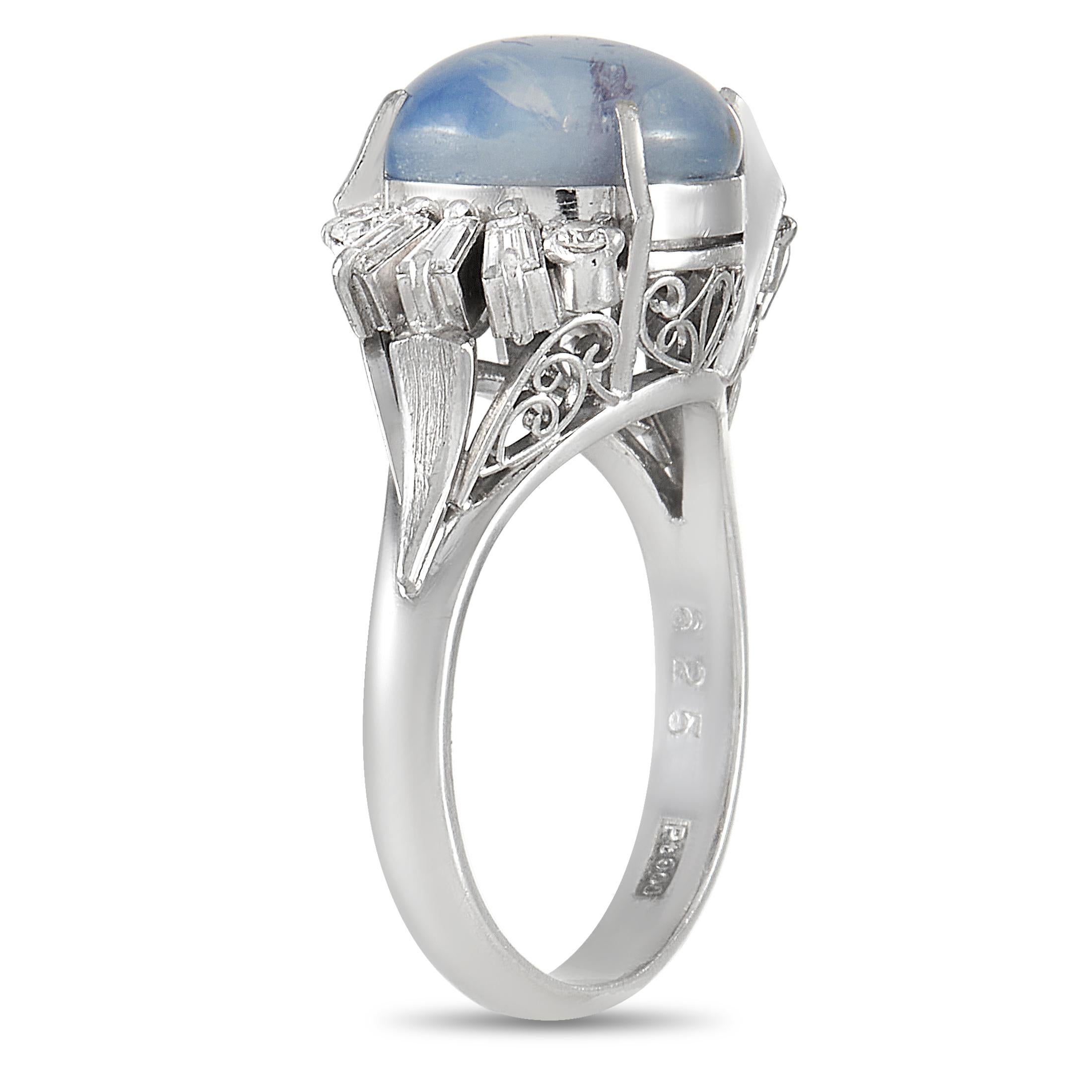 This luxurious ring defies convention in the best way possible. A cloudy 6.25 carat star sapphire center stone adds understated elegance to this enchanting design. An array of diamonds with a total weight of 0.36 carats sparkle and shine from their