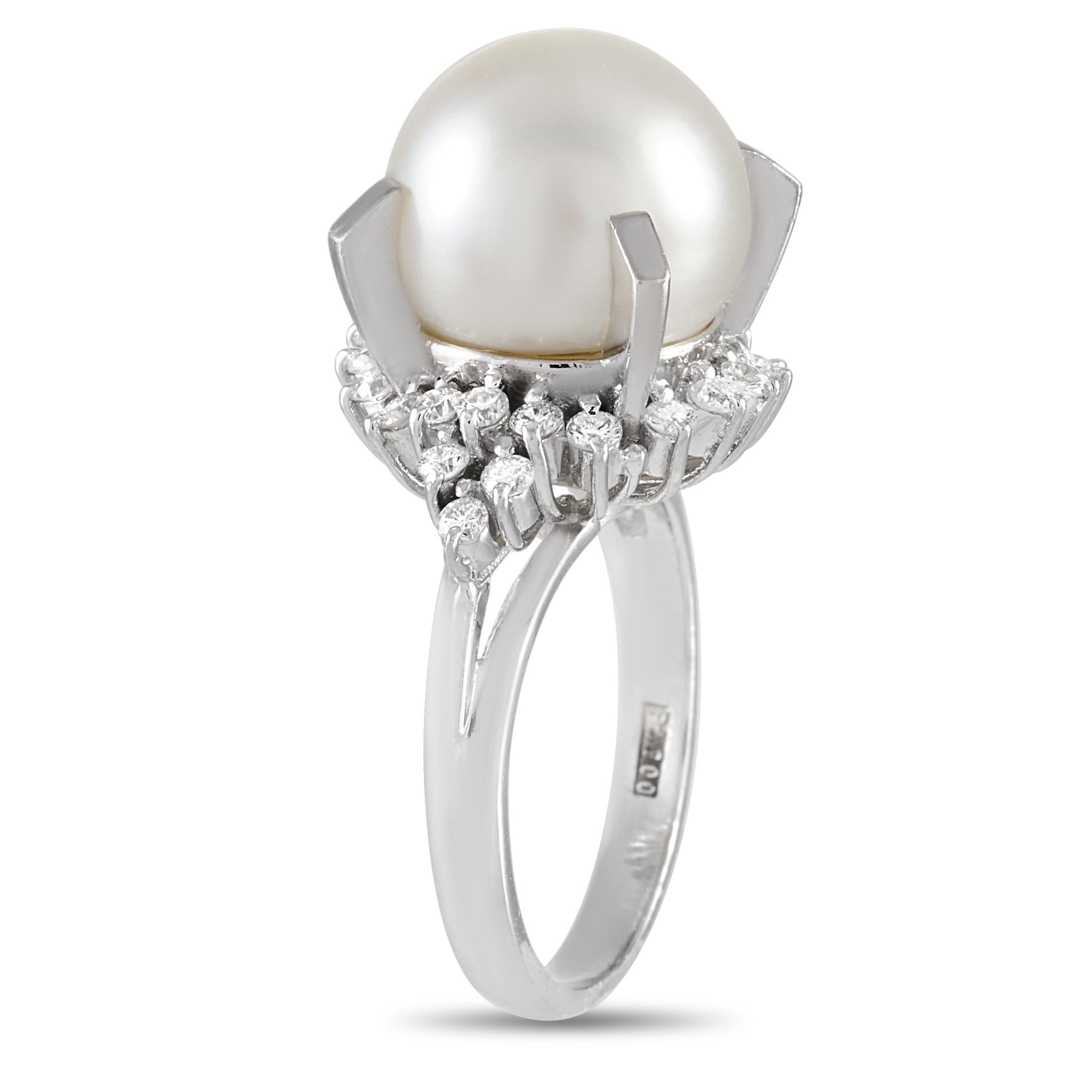 This LB Exclusive ring is made of platinum and embellished with an 11.5 mm pearl and a total of 0.47 carats of diamonds. The ring weighs 8.8 grams and boasts band thickness of 2 mm and top height of 15 mm, while top dimensions measure 15 by 18 mm.
