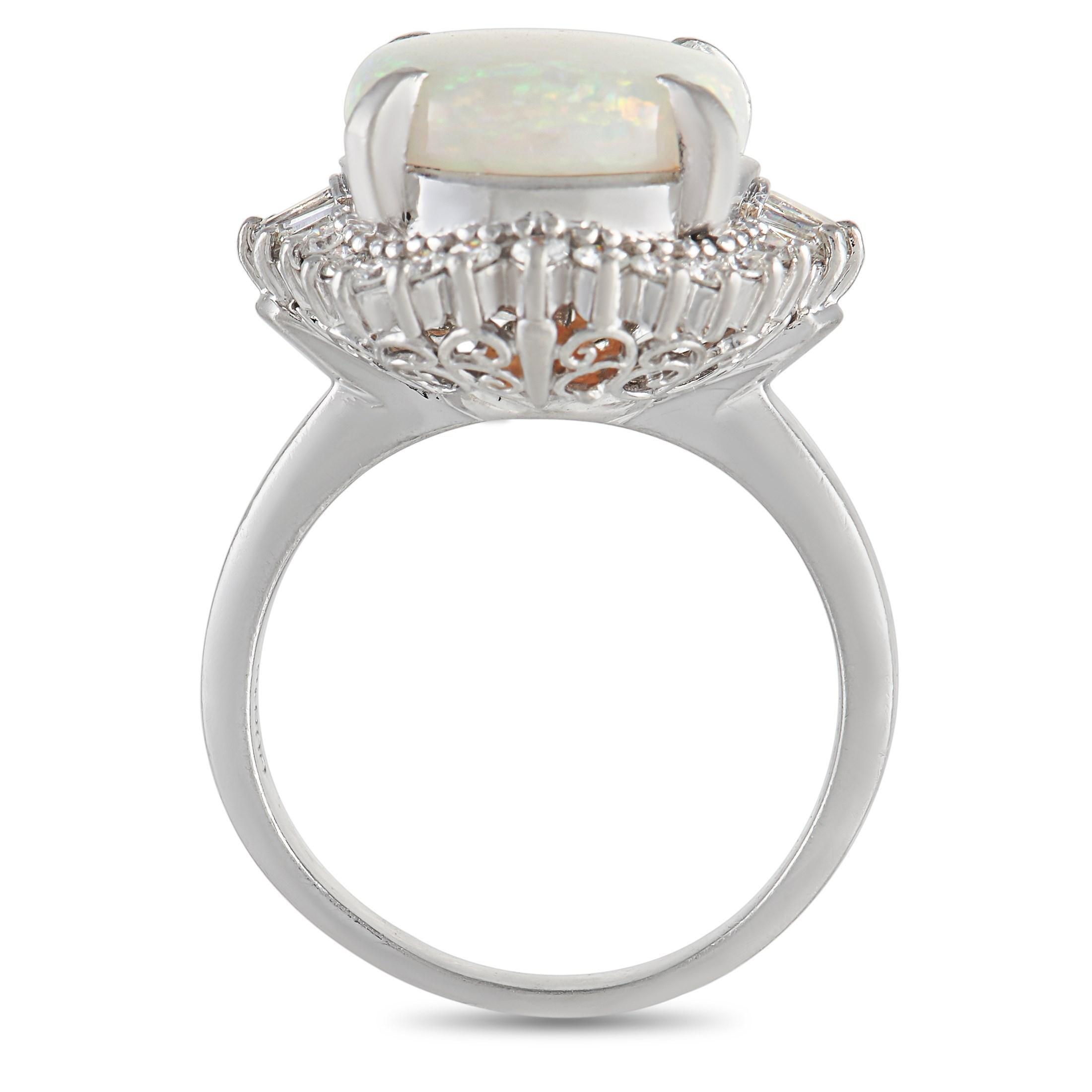 This enchanting ring will continually capture your imagination. A fiery 3.77 carat Opal center stone comes to life thanks to the dynamic halo of diamonds, which together possess a total weight of 0.57 carats. Crafted from Platinum, it features a 2mm