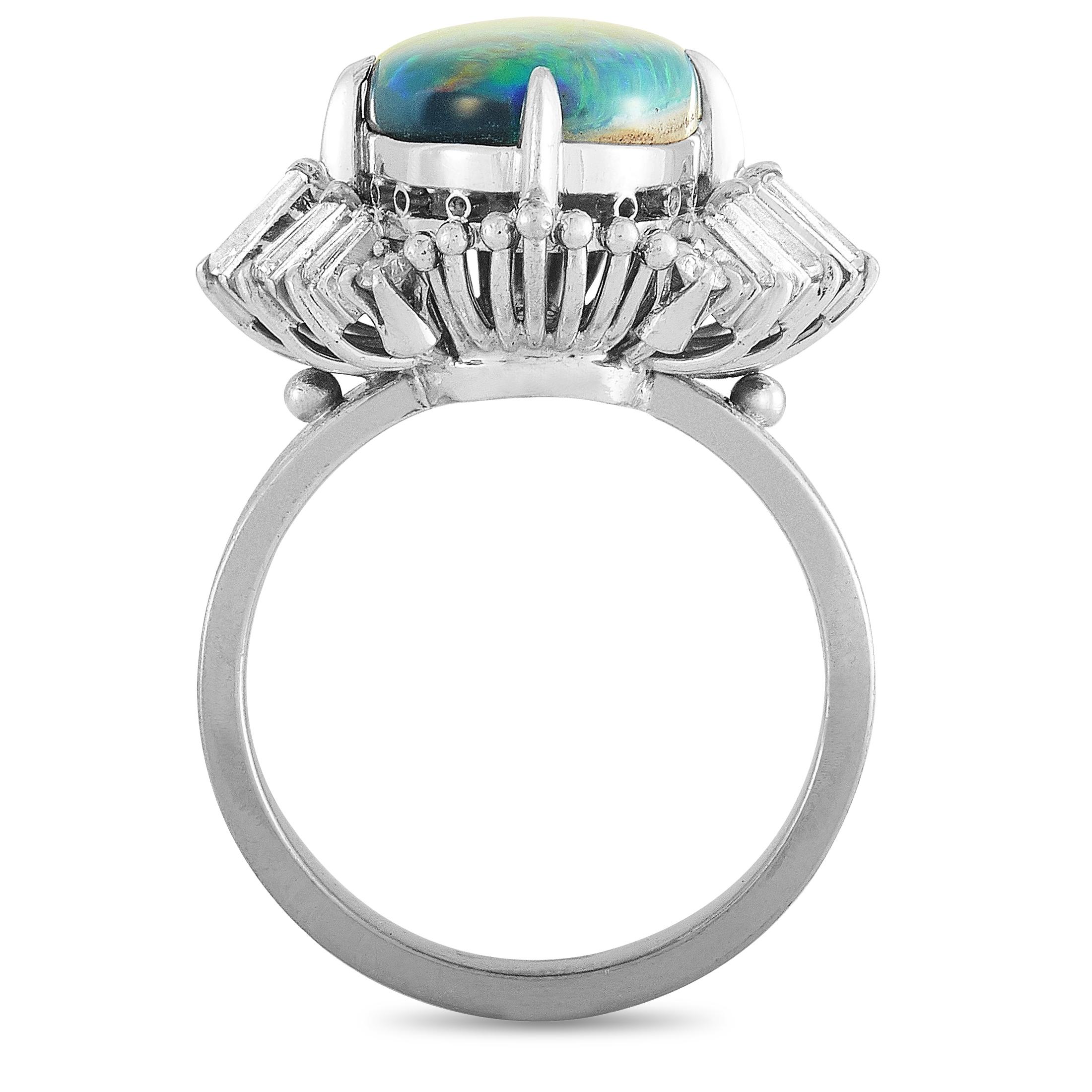 This LB Exclusive ring is made of platinum and set with a 4.37 ct opal and a total of 0.67 carats of diamonds. The ring weighs 10.6 grams, boasting band thickness of 3 mm and top height of 10 mm, while top dimensions measure 20 by 18 mm.
 
 Offered