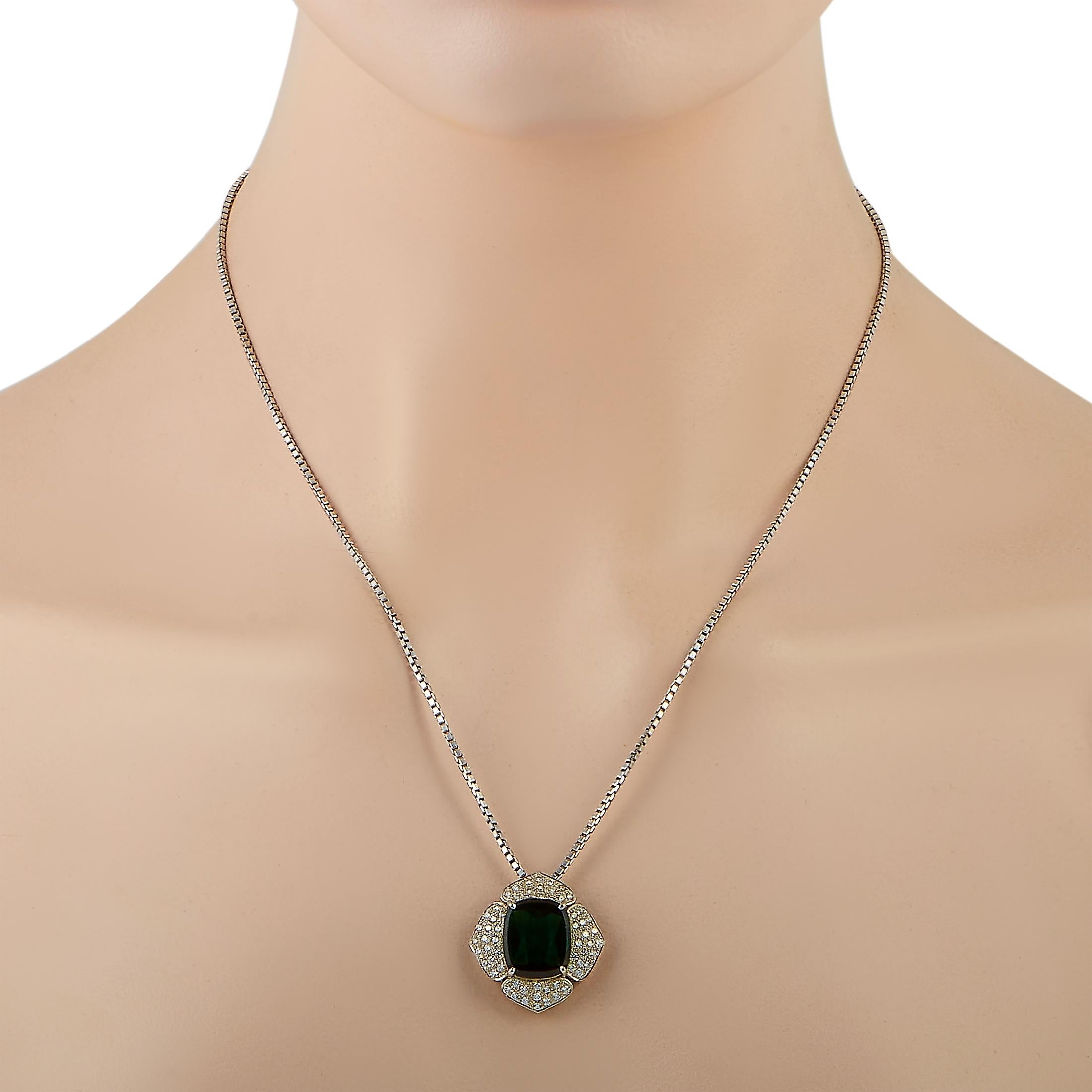 This LB Exclusive necklace is crafted from platinum and weighs 20.6 grams. It is presented with a 19” chain and a pendant that measures 1” in length and 1” in width. The necklace is set with a 7.89 ct tourmaline and a total of 0.74 carats of