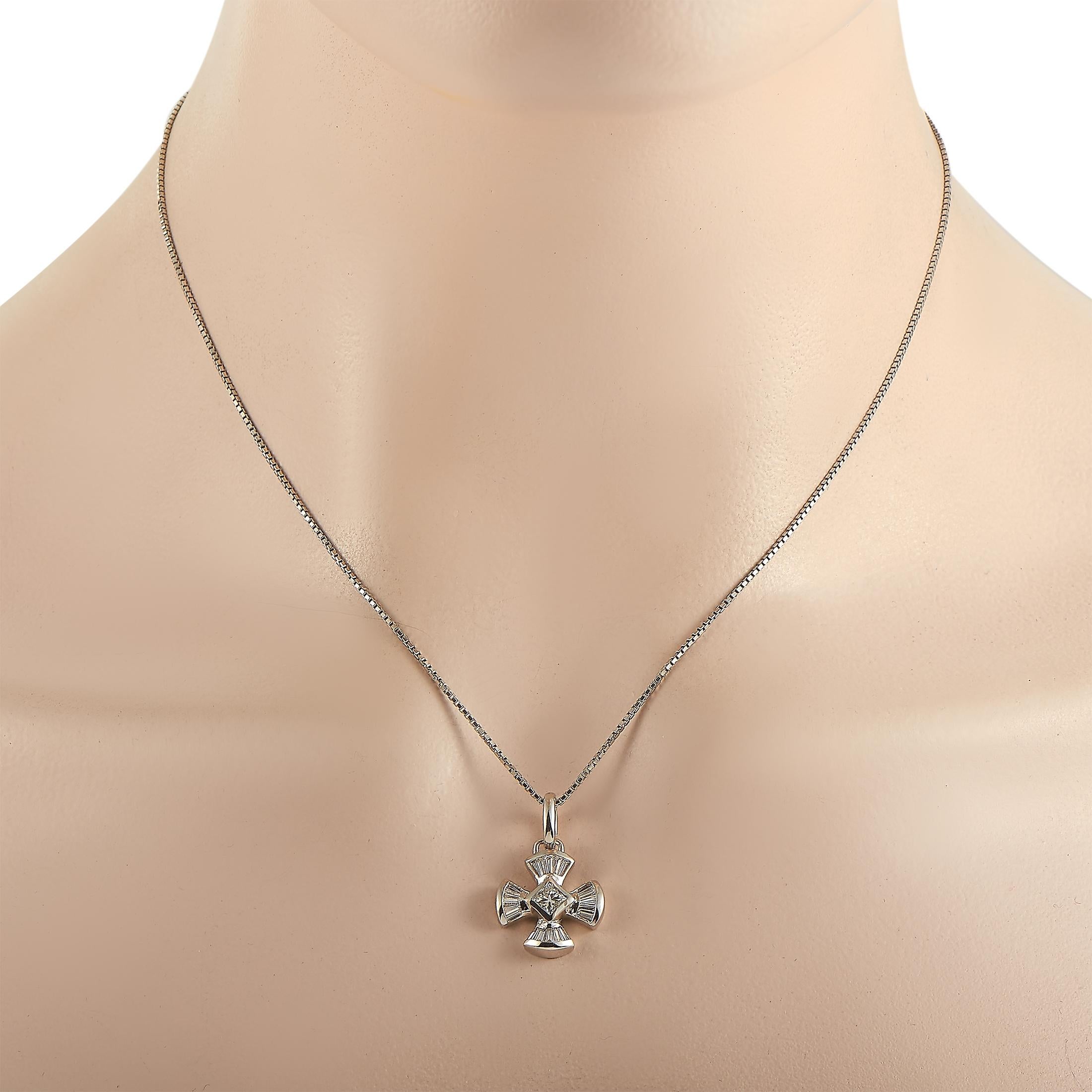 This LB Exclusive necklace is made of platinum and weighs 9.6 grams. It is presented with a 17” chain and a pendant that measures 1” in length and 0.75” in width. The necklace is embellished with diamonds that amount to 0.75 carats.
 
 Offered in