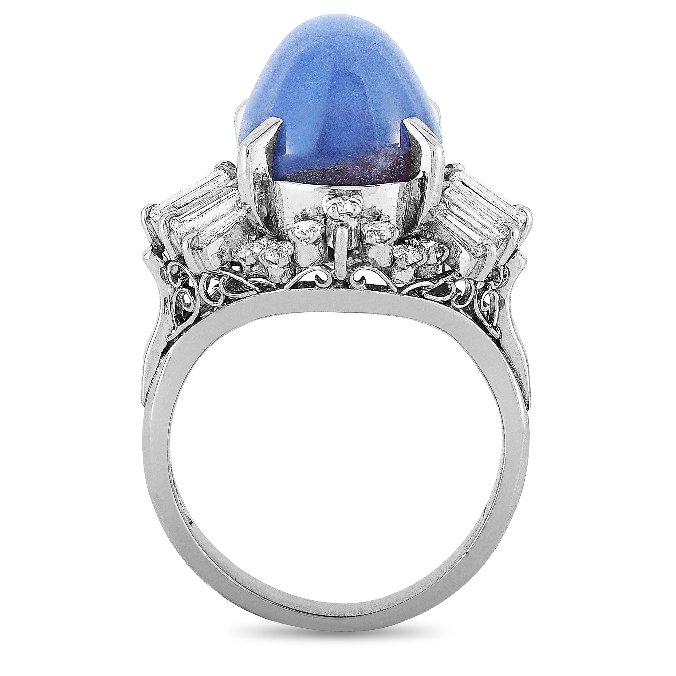 This LB Exclusive ring is made of platinum and embellished with a sapphire that weighs 9.57 carats and a total of 0.78 carats of diamonds. The ring weighs 8.9 grams and boasts band thickness of 3 mm and top height of 13 mm, while top dimensions