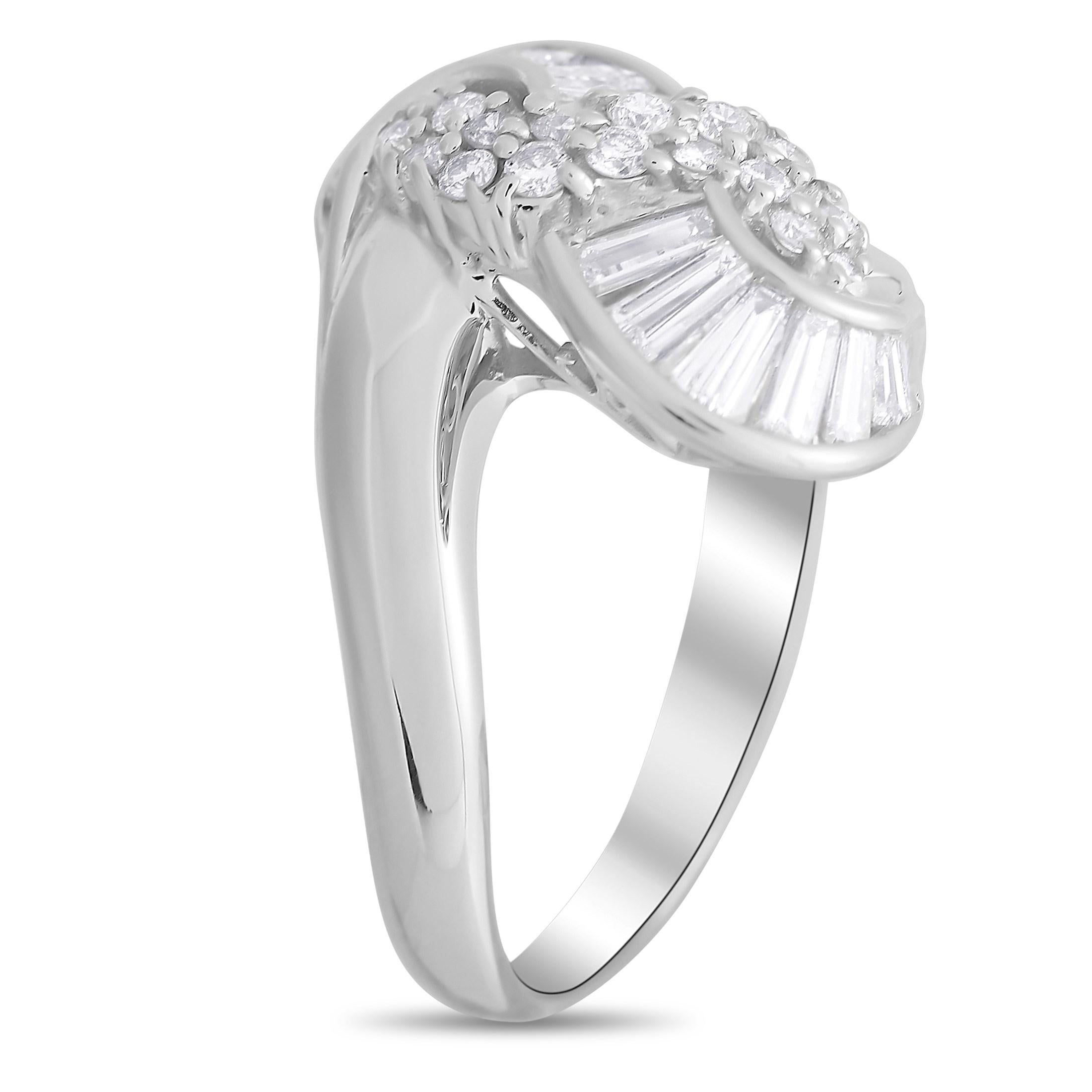 This luxury ring’s Platinum setting possesses a stunning sense of movement. Its gracefully curved lines are only enhanced by the presence of sparkling diamonds, which together total 0.81 carats. It features a 3mm wide band and a 6mm top height,