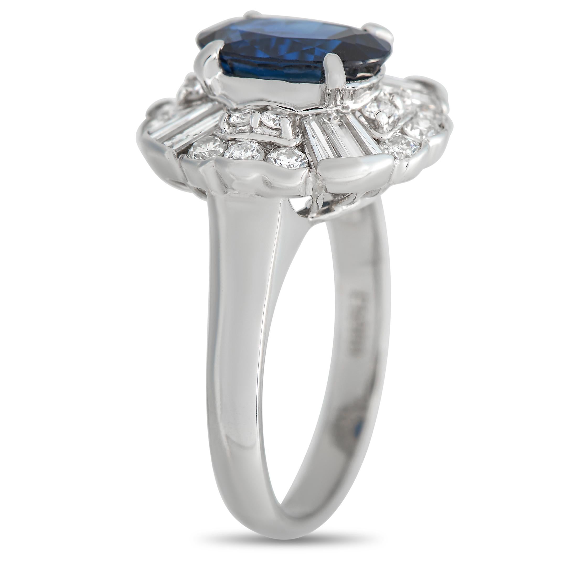 A captivating 2.07 carat sapphire center stone serves as a stunning focal point of this classically elegant ring. Surrounding the center stone, an exquisite array of sparkling diamonds totaling 0.82 carats further elevates the platinum setting. This
