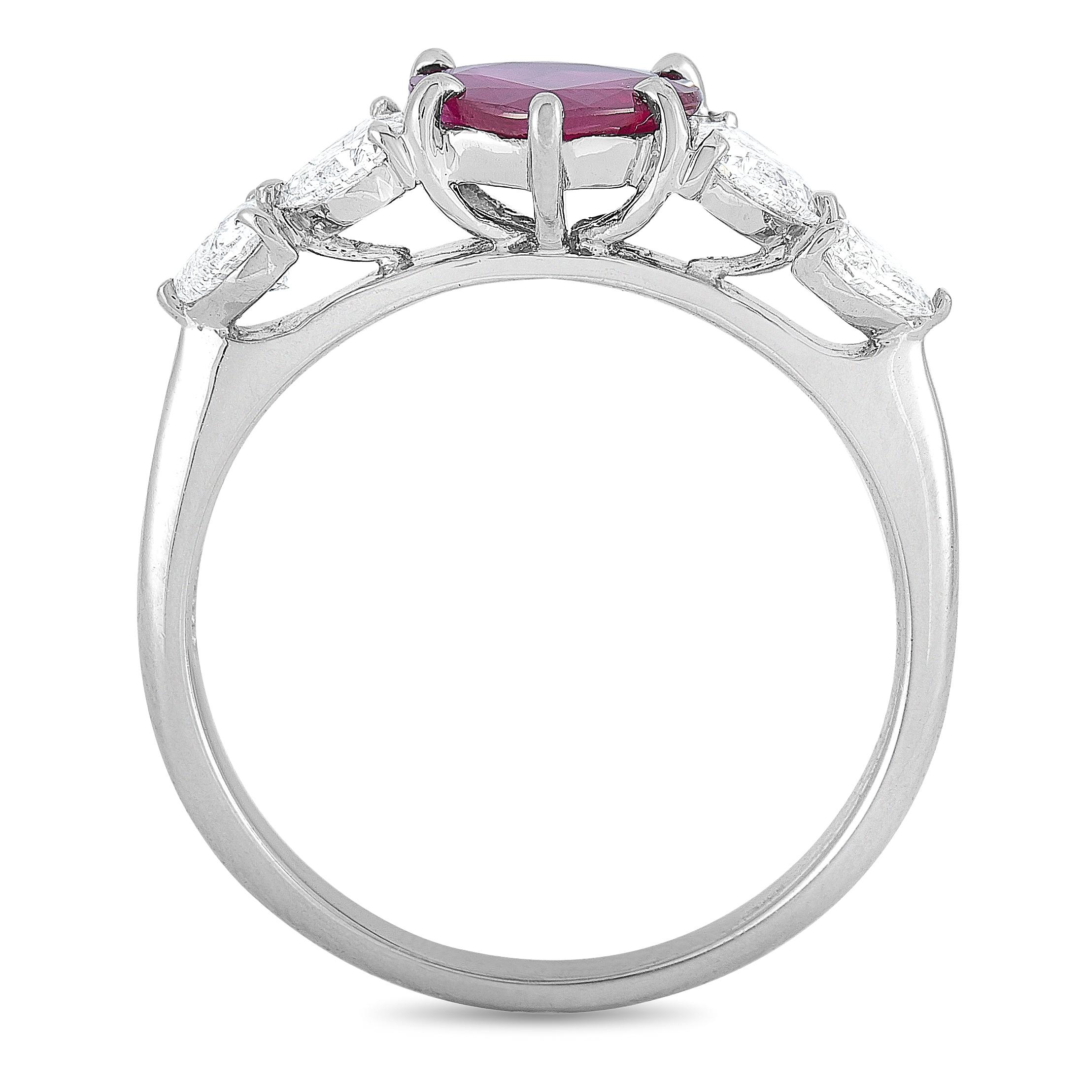 This LB Exclusive ring is crafted from platinum and weighs 5.1 grams, boasting band thickness of 2 mm and top height of 5 mm, while top dimensions measure 20 by 7 mm. The ring is set with a 1.30 ct heart-shaped ruby and a total of 0.85 carats of