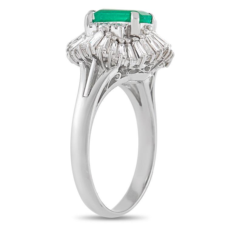 This glamorous LB Exclusive Platinum 1.00 ct Diamond and Emerald Ring is the perfect touch of sparkle. The simple band is made with platinum and highlights a stunning 1.45 carat emerald center stone held in place by four prongs. The emerald is