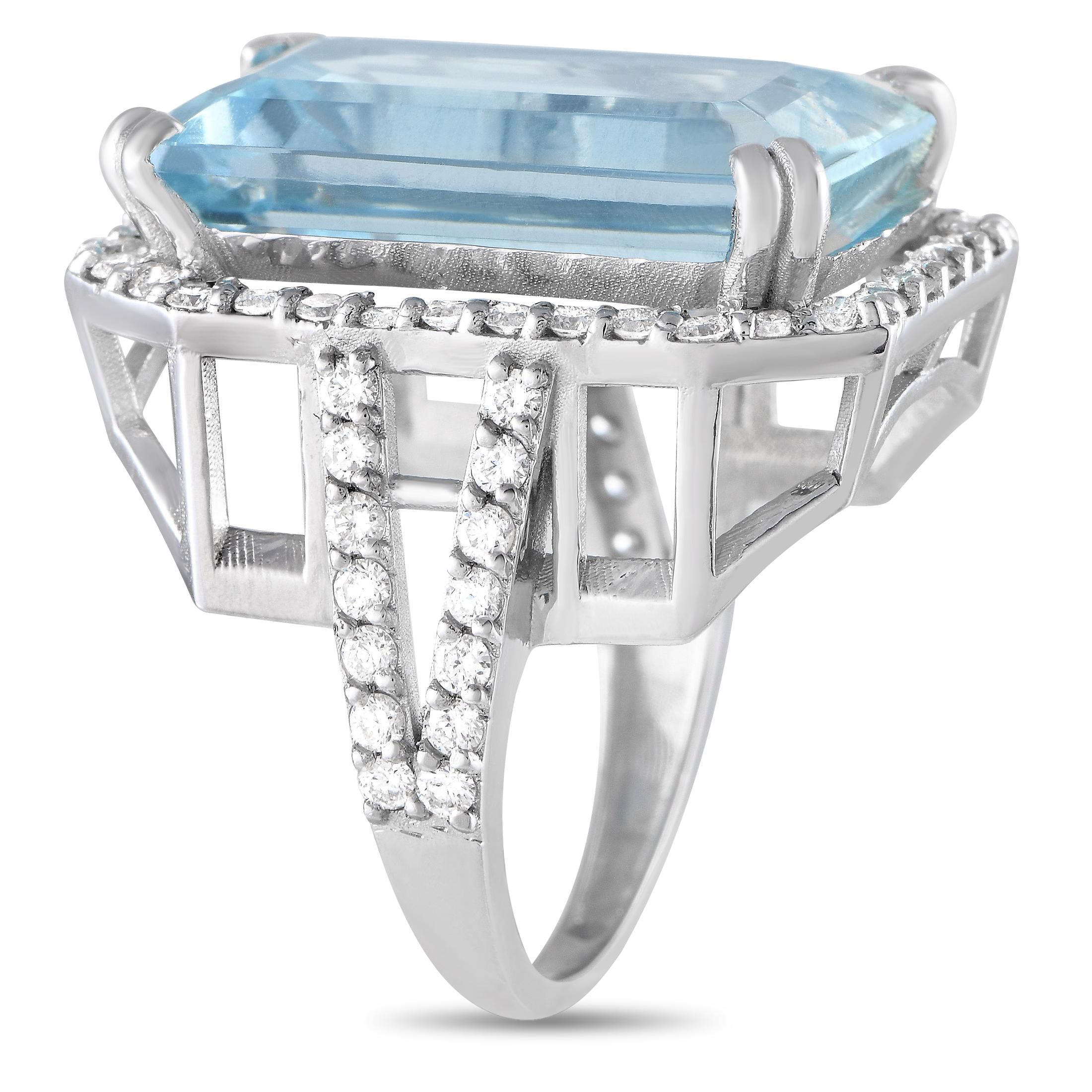 Expect to fall in love with this delicate and dramatic diamond and aquamarine ring. It features a glittering split shank in everlasting platinum, anchoring an oversized centerpiece set with a stunning 14.06-ct aquamarine framed by round diamonds.