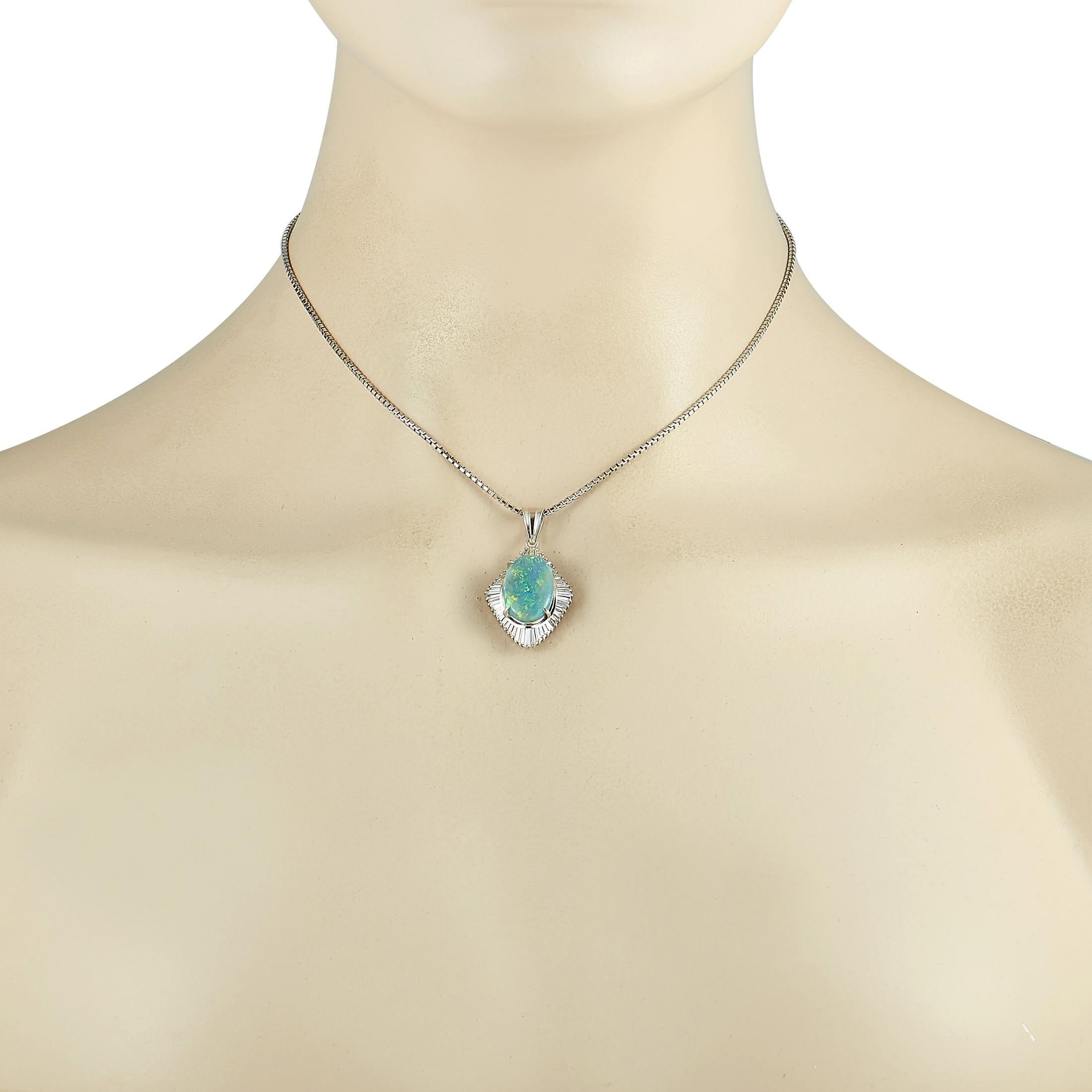 This LB Exclusive necklace is crafted from platinum and weighs 17.5 grams. It is presented with a 15” chain and a pendant that measures 1.37” in length and 0.75” in width. The necklace is embellished with a 5.10 ct black opal and a total of 1.36