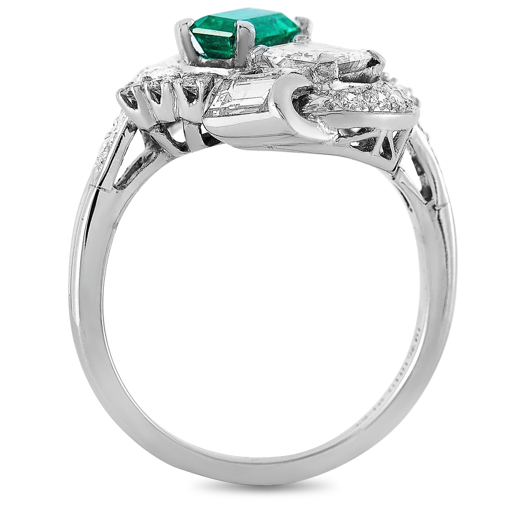 This LB Exclusive ring is crafted from platinum and weighs 8 grams, boasting band thickness of 1 mm and top height of 6 mm, while top dimensions measure 18 by 20 mm. The ring is set with a 0.62 ct emerald and a total of 1.51 carats of diamonds, with